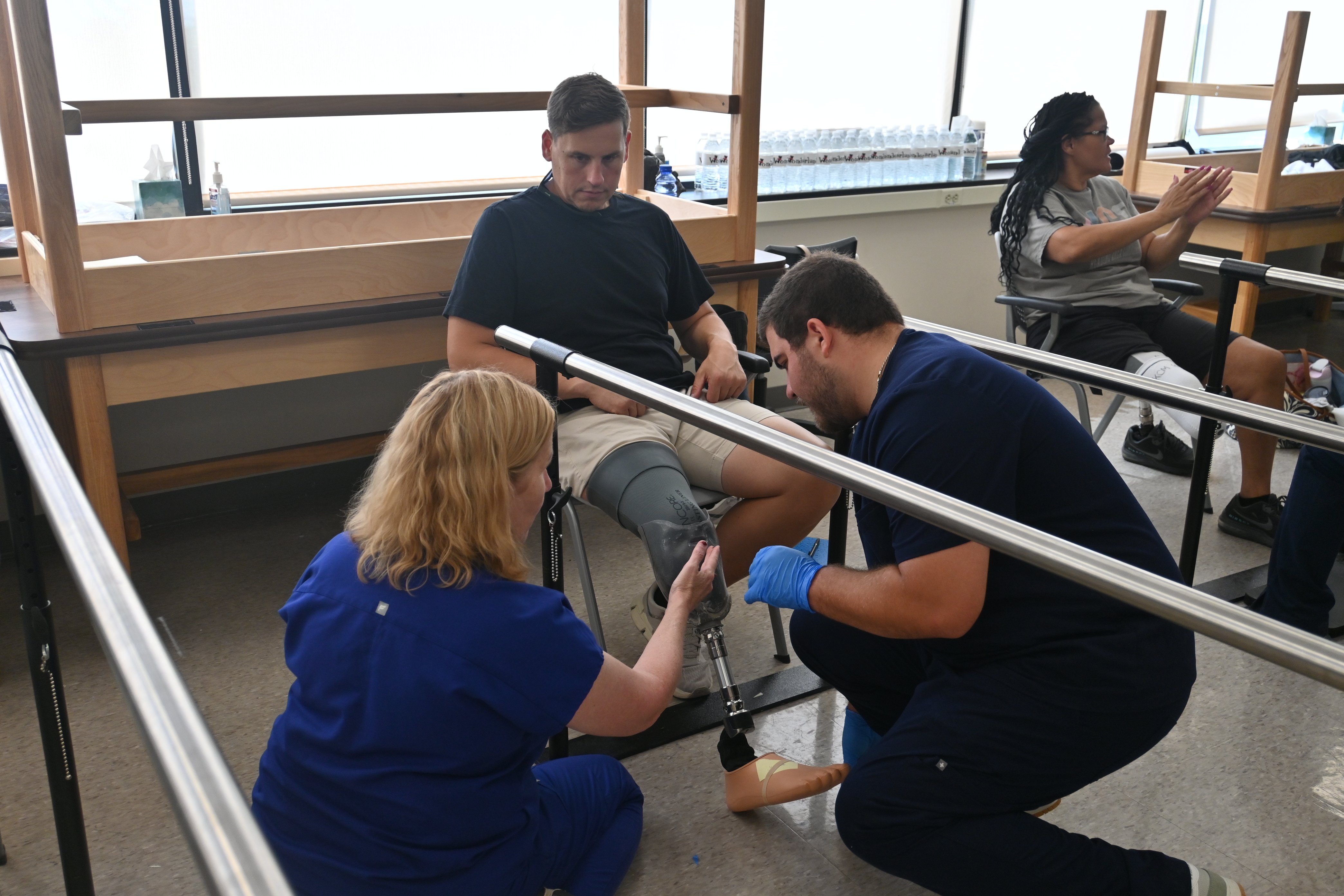 O&P faculty and student with patient model