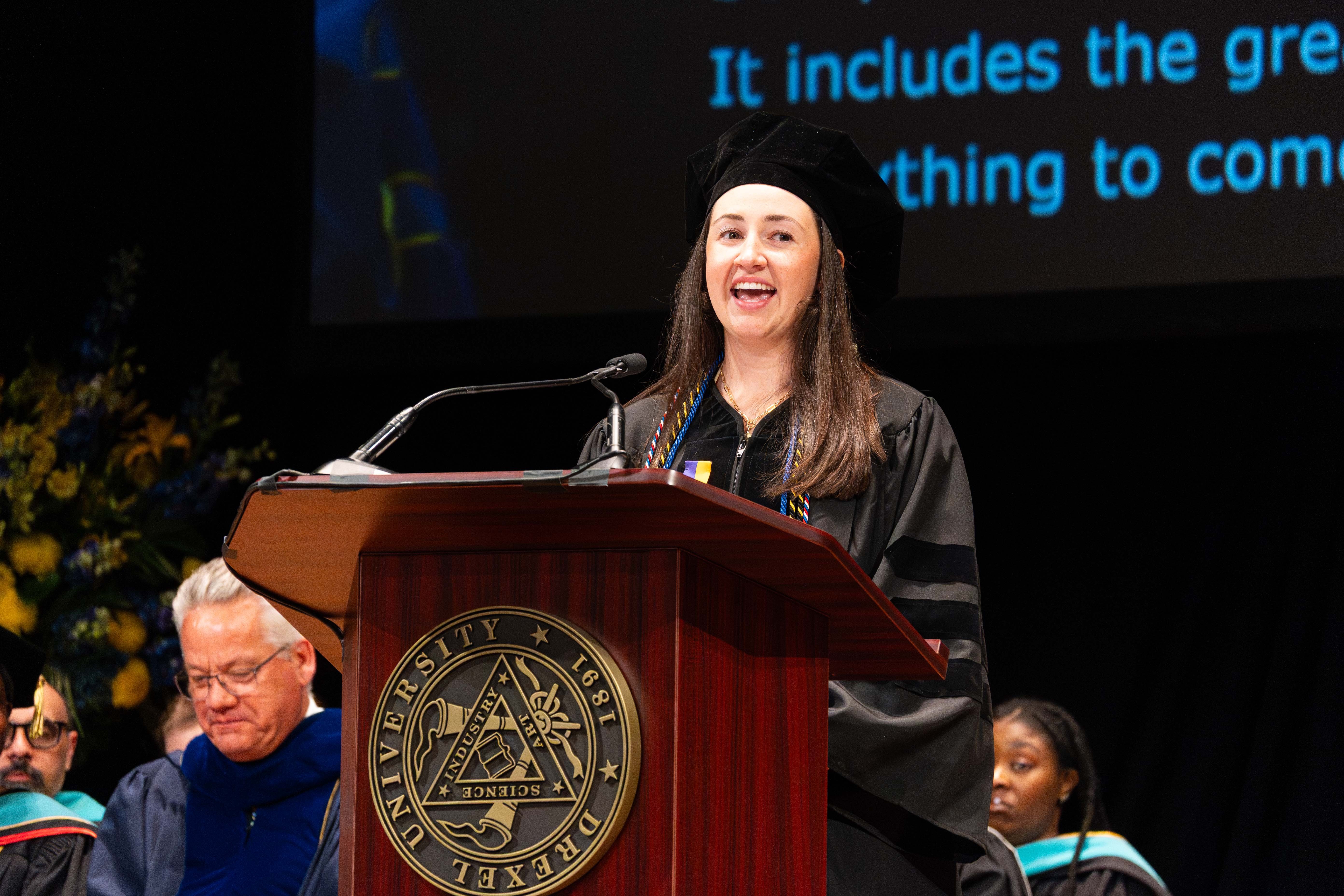 PCO valedictorian Anna German at the podium