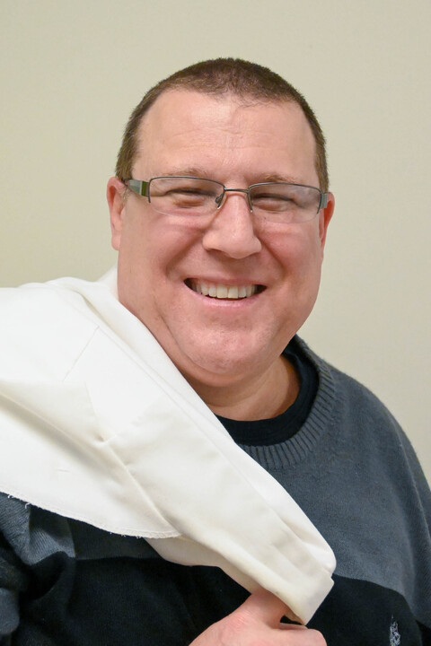 Andrew Gurwood headshot with white coat