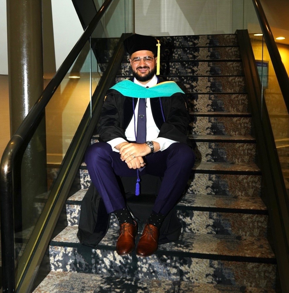 Atif Khan in cap and gown