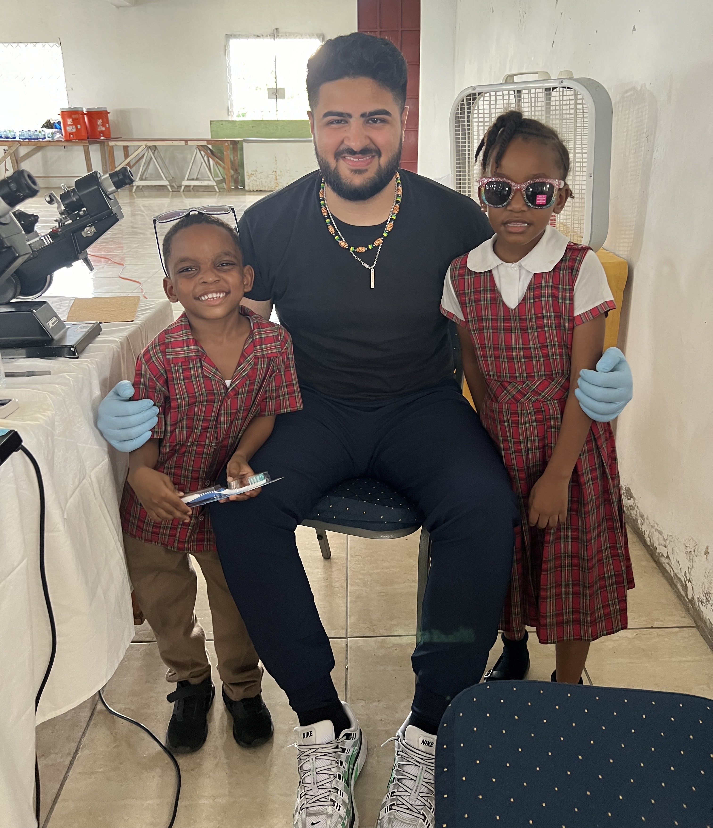 Atif Khan with two children on mission trip
