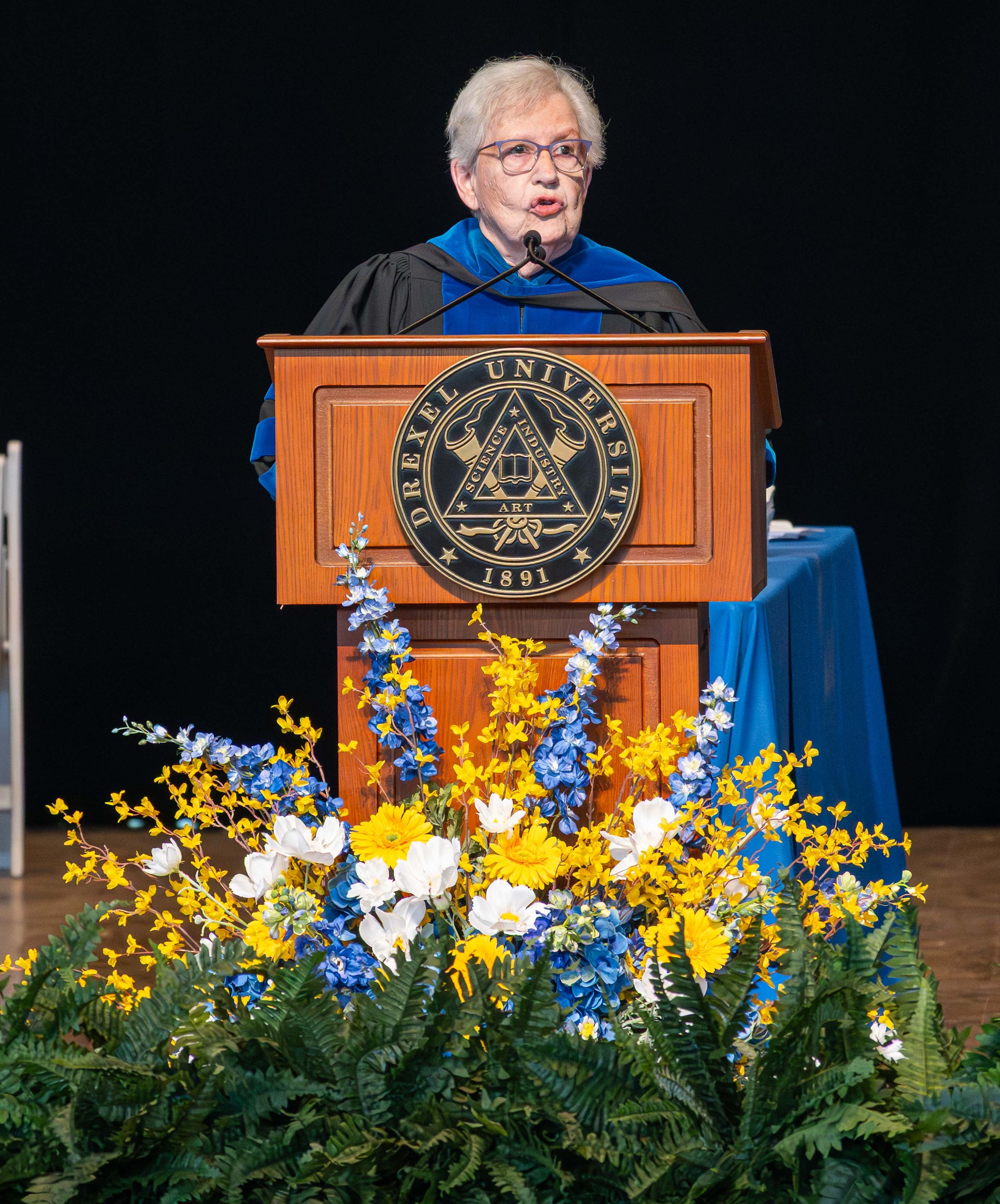 Commence speaker Gloria Donnelly at podium
