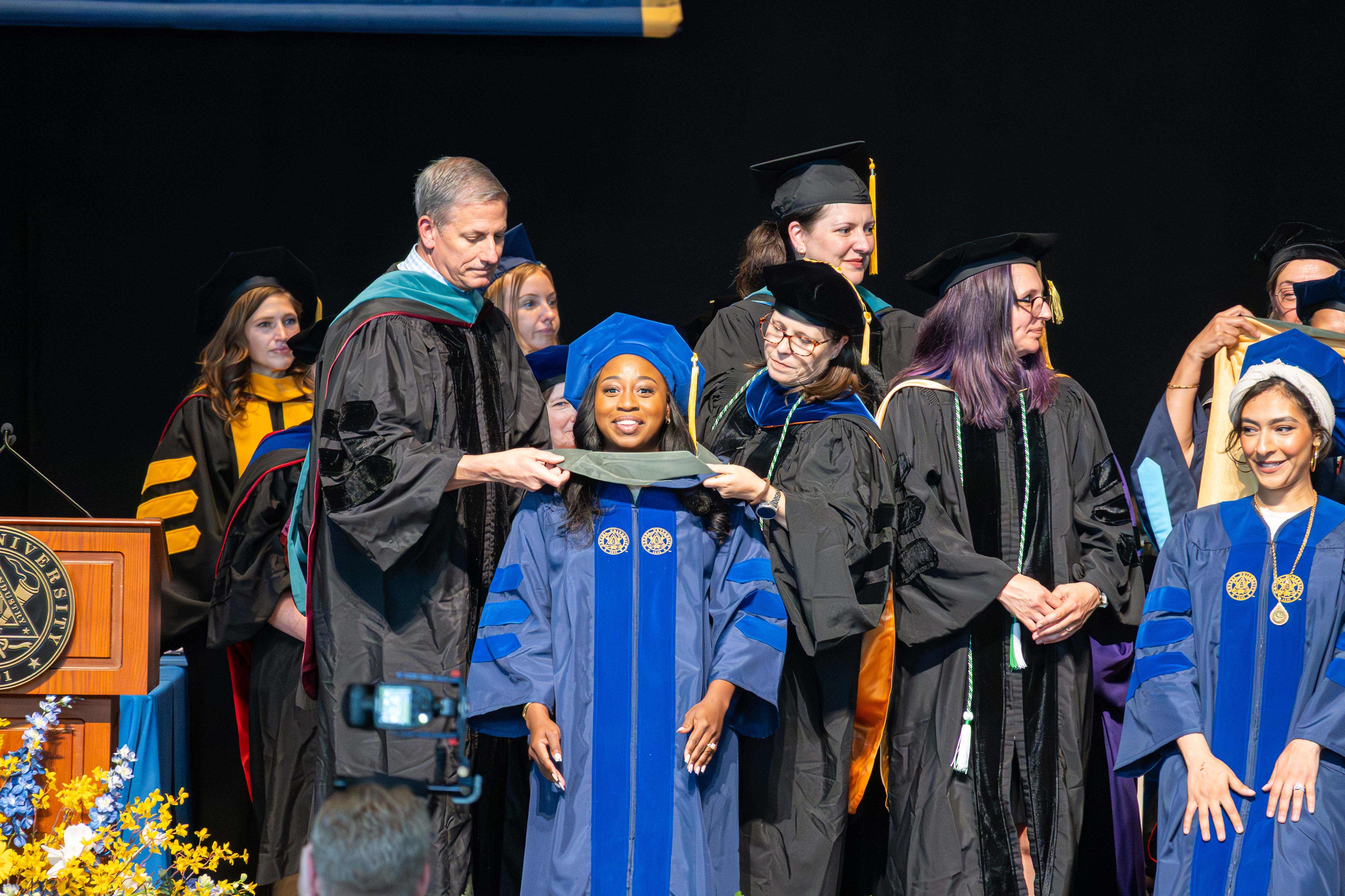 EP student receives hood at commencement