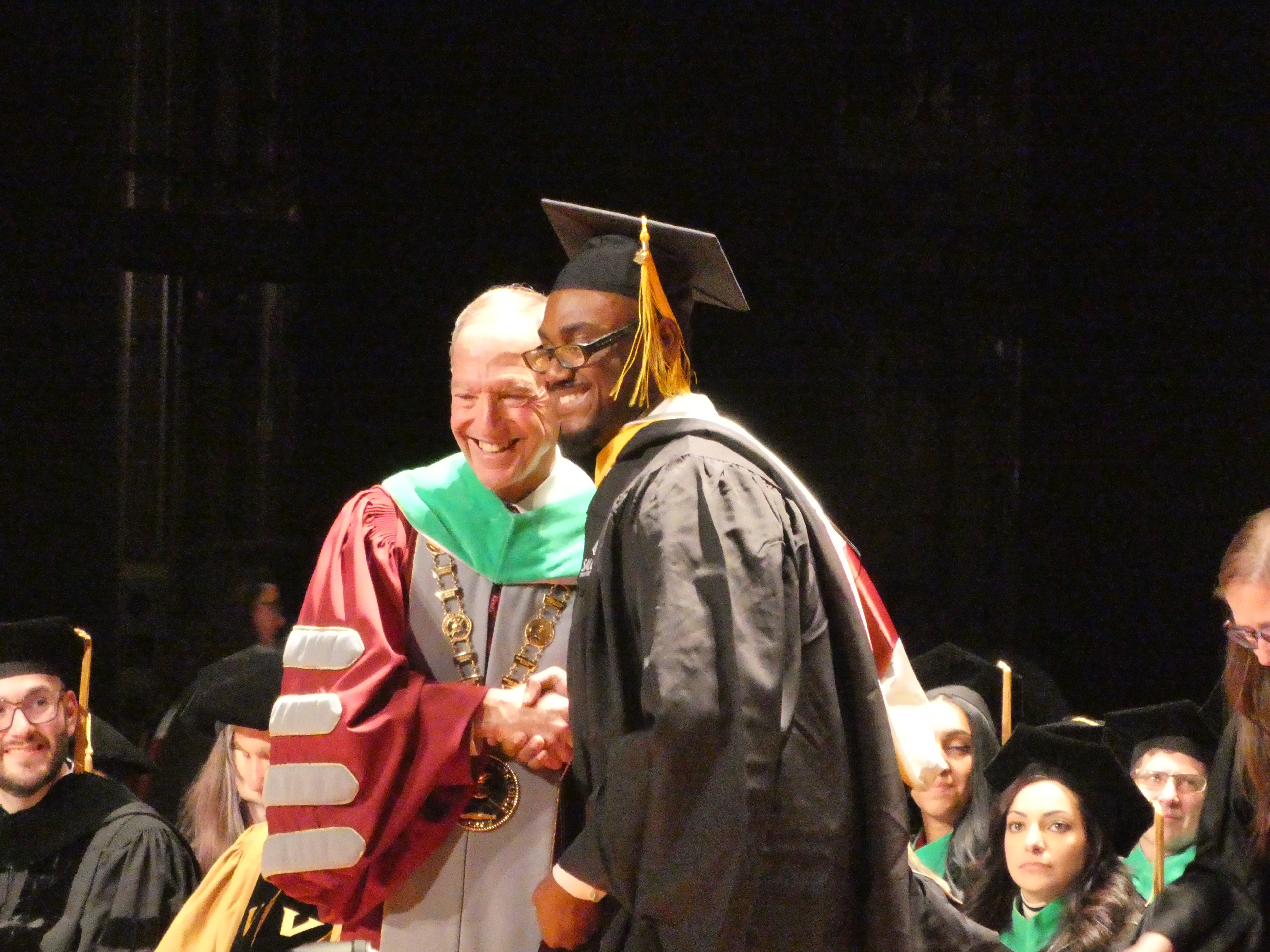 Antonio Butler and MHM at commencement