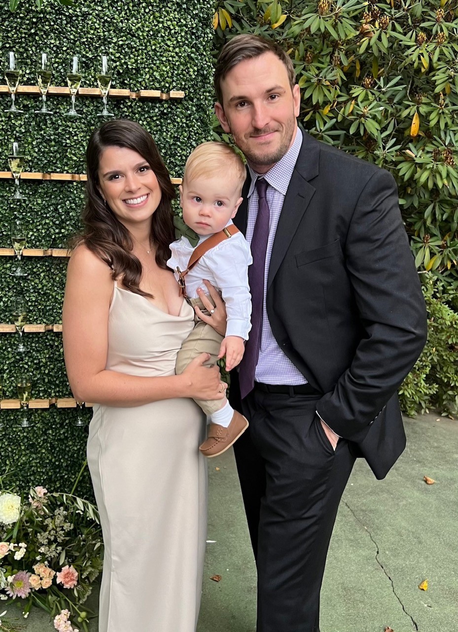 Emily Jolotta and husband with baby