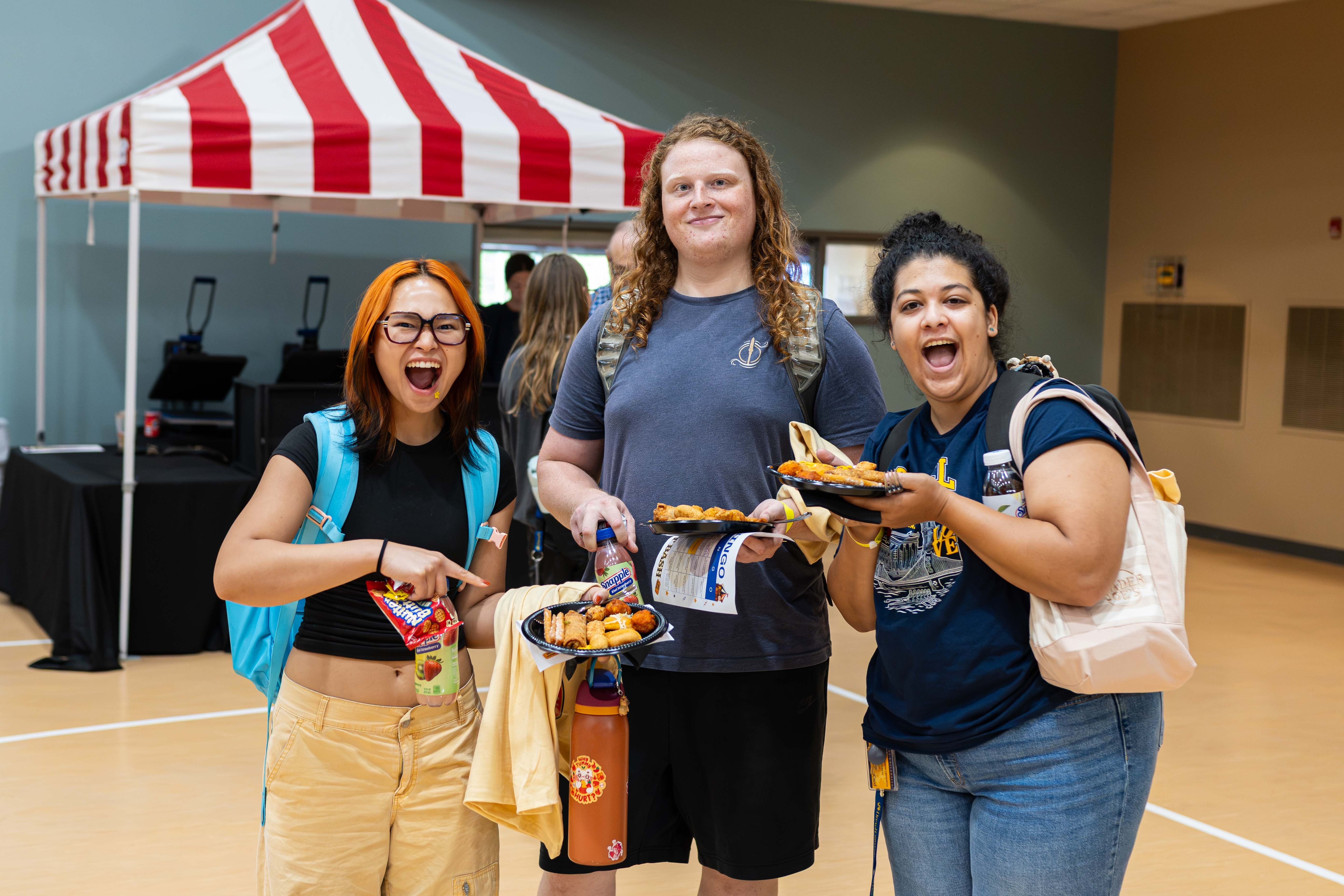 Three O&P students with their dinner at First Bash