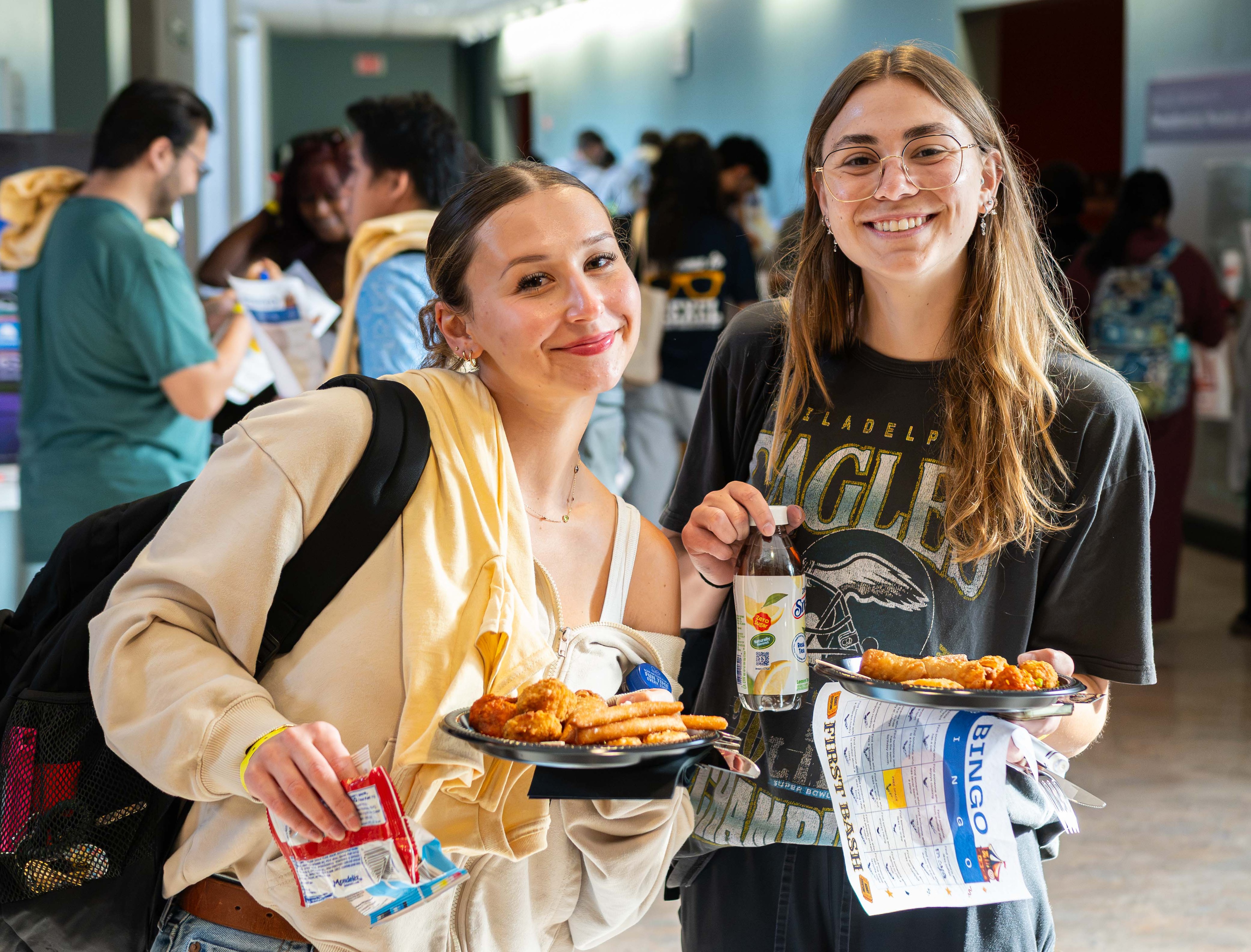 Two students grab dinner at First Bash