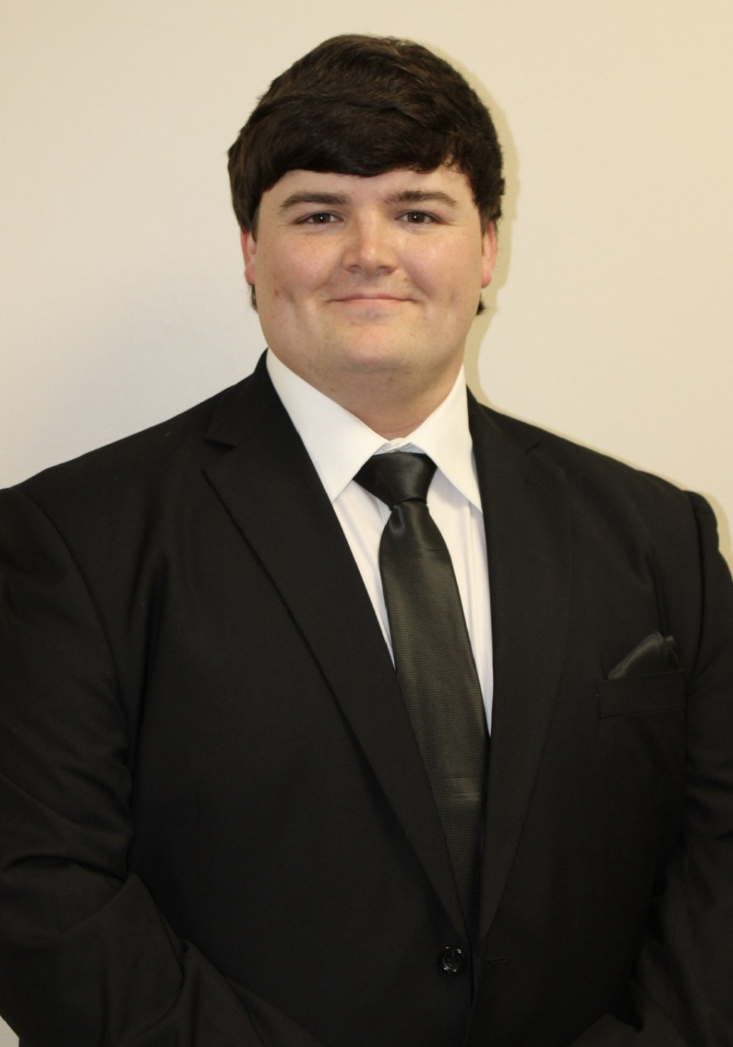 Justin Hornung headshot in shit and tie