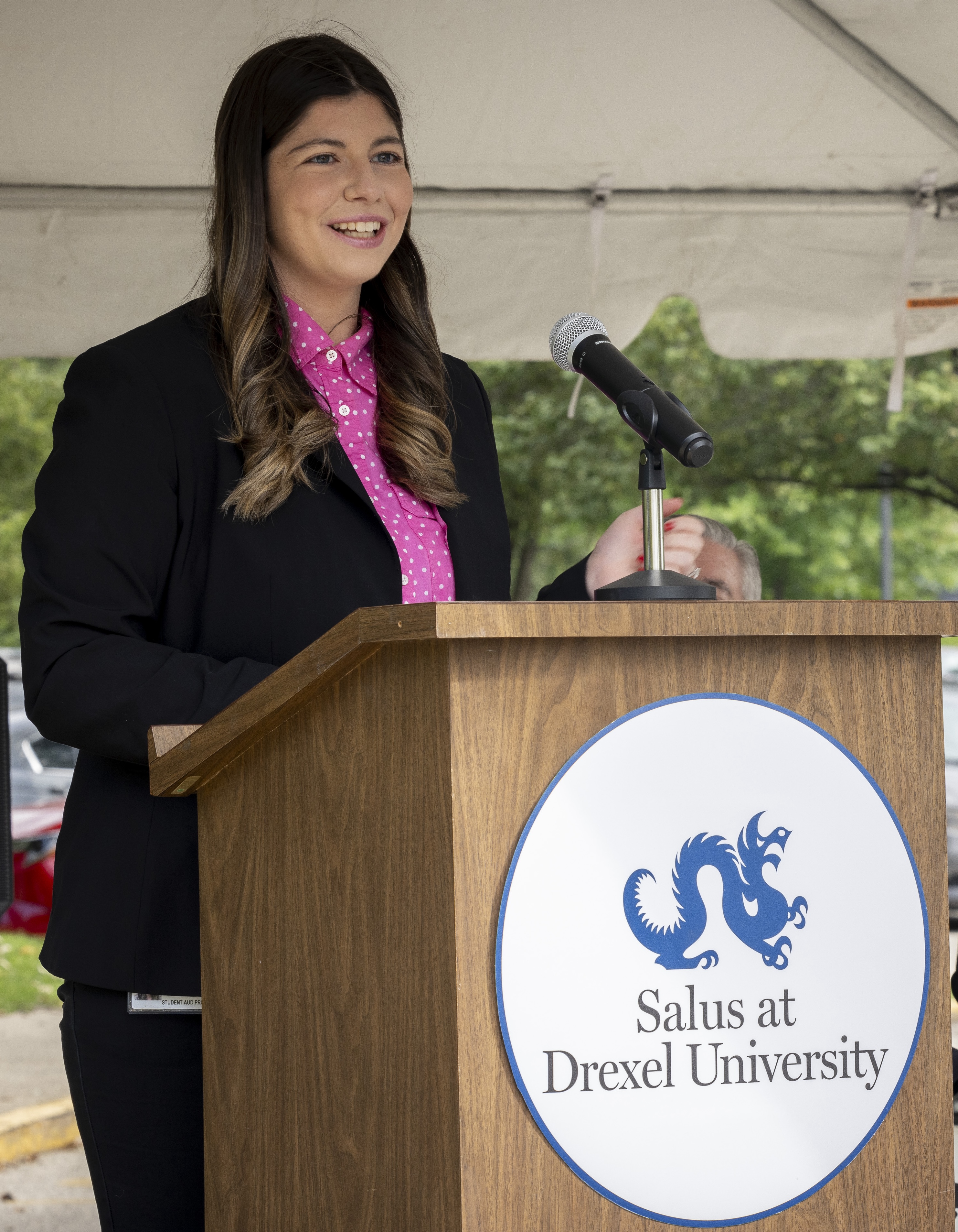 Kristin Battista speaking at podium