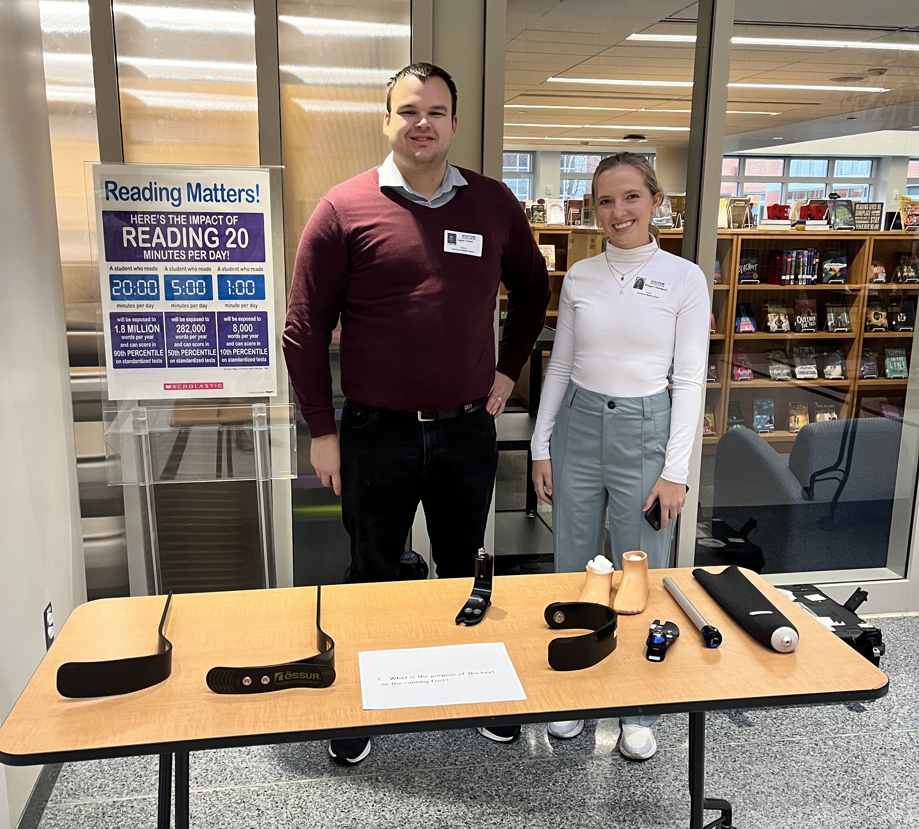 Logan Tonini at table with a colleague