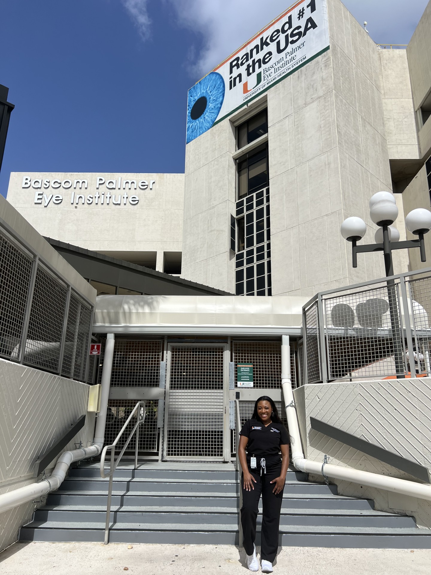 Dr. Williams in front of Bascom Palmer Eye Institute