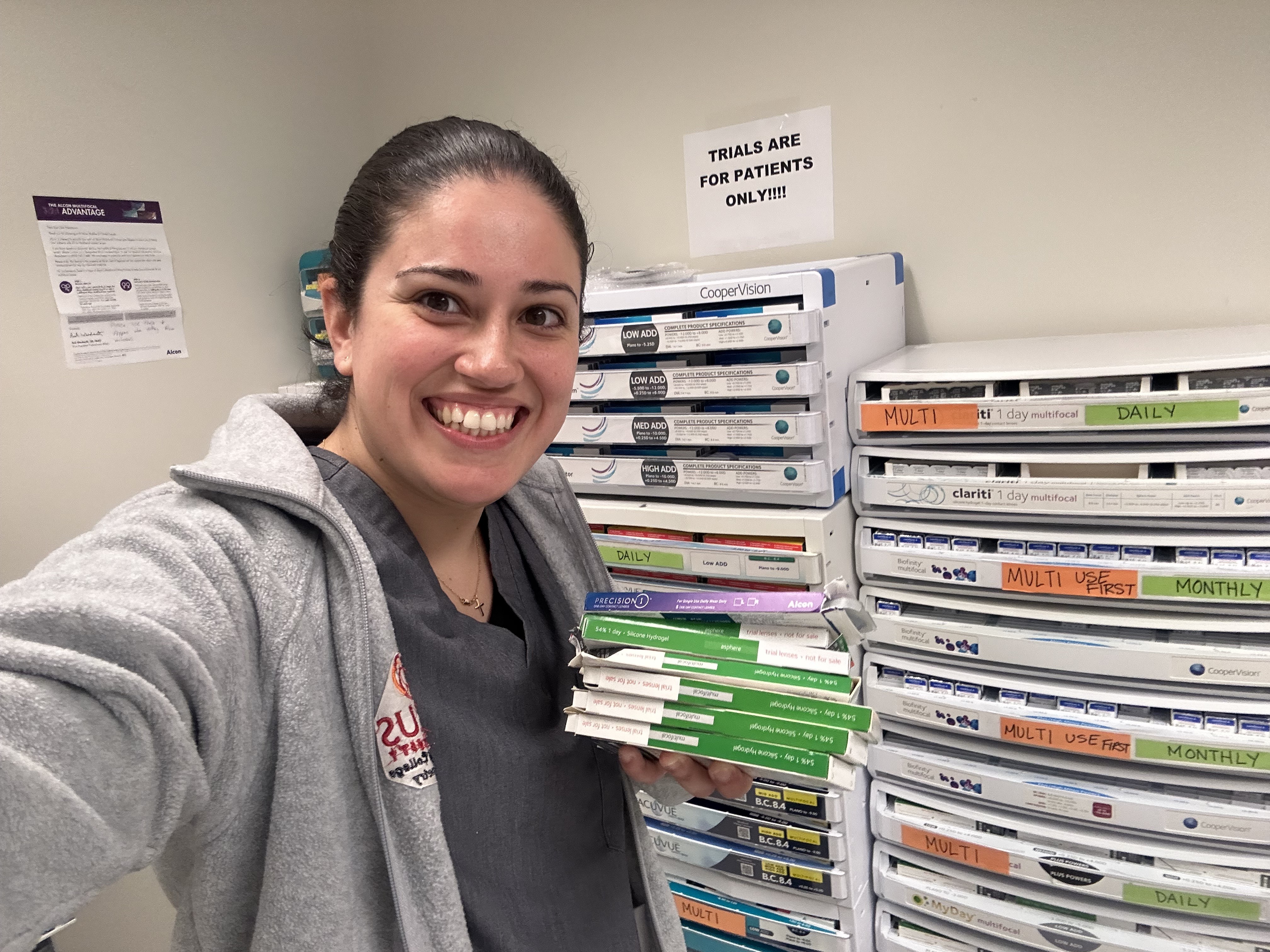 Mariana Garcia holding contact lens boxes