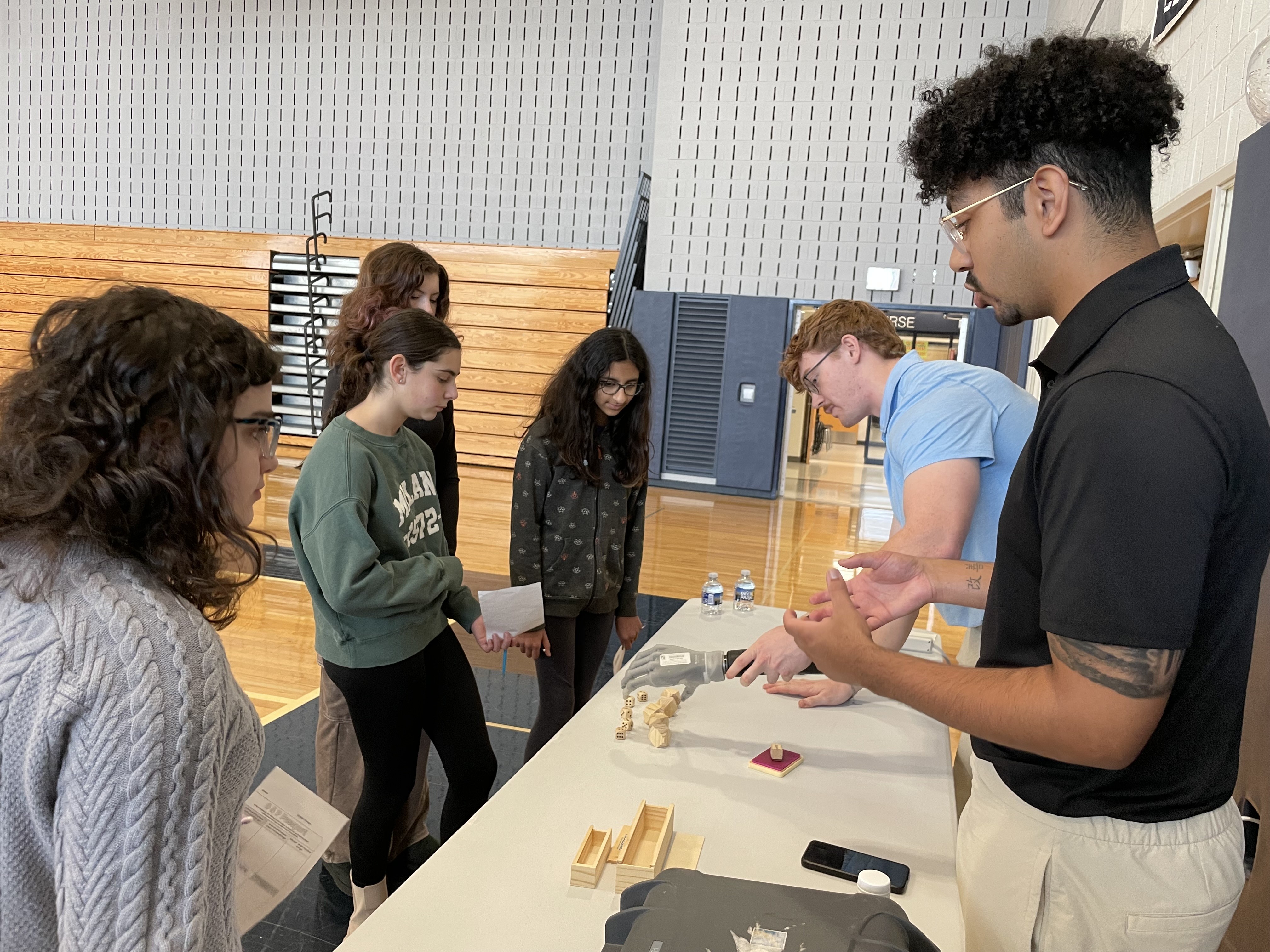 O&P students giving demonstration at table