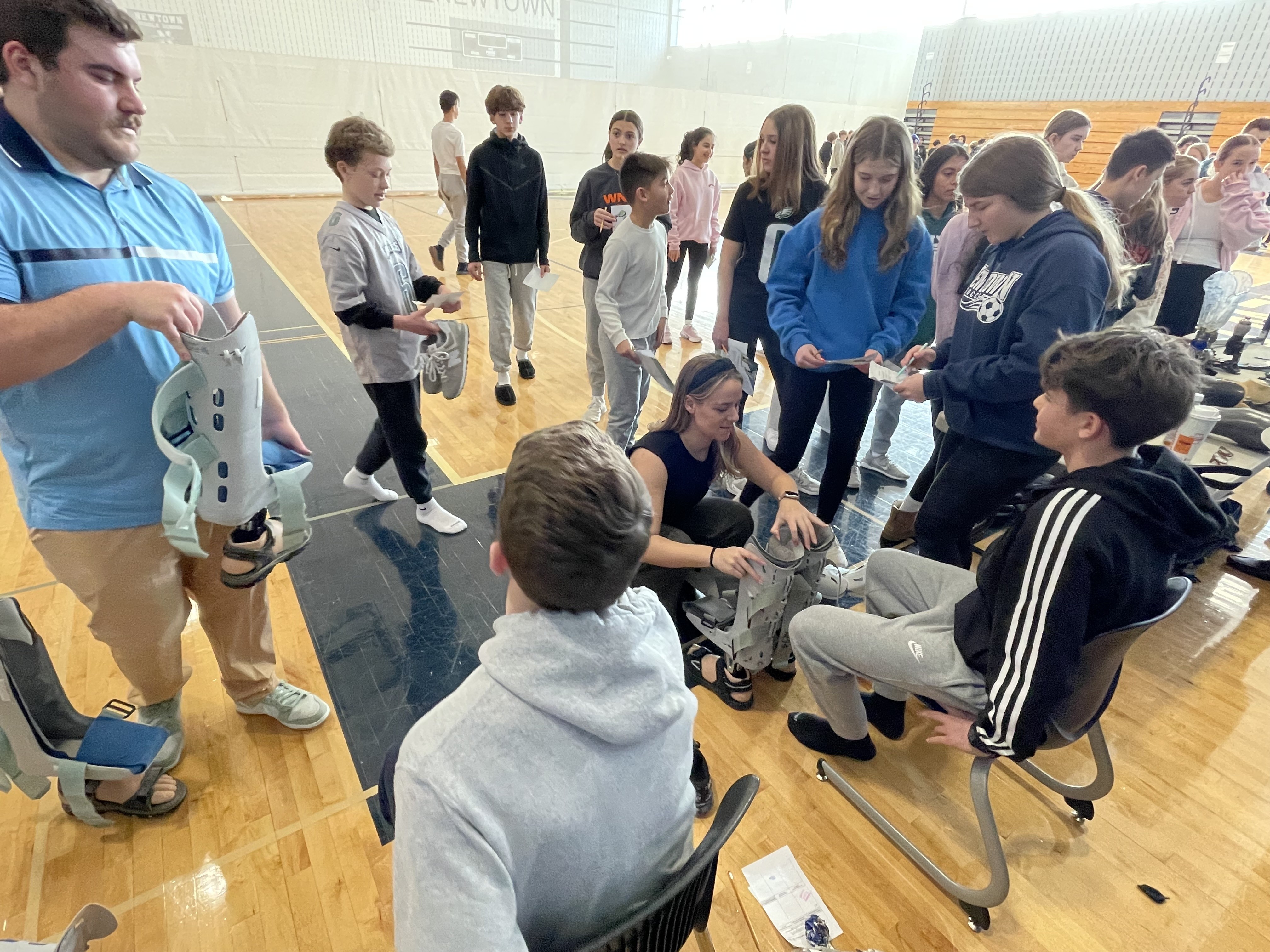 Students being fitted with prosthetics