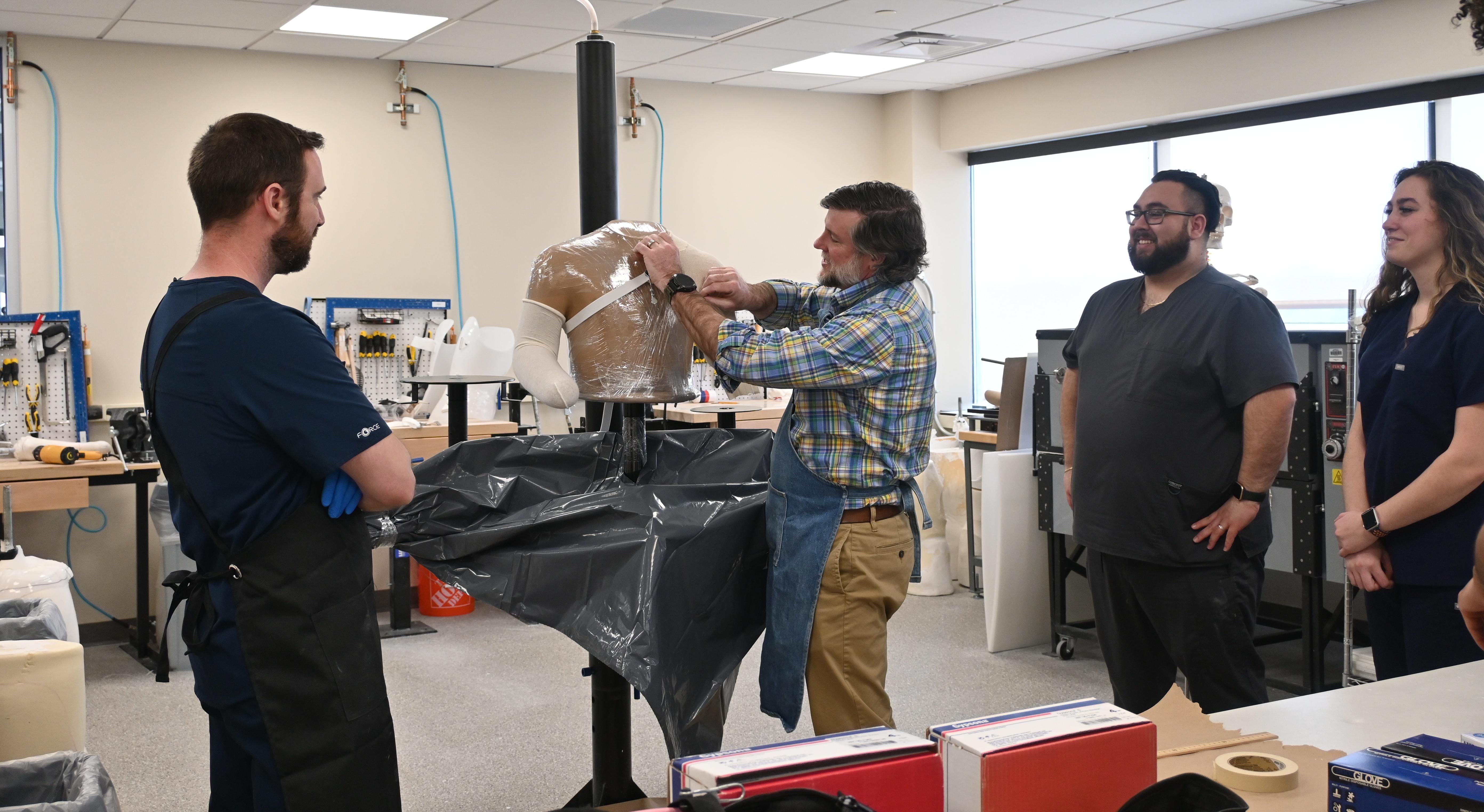 Dr. Duncan with students in the O&P lab
