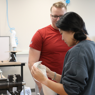 O&P students holding an arm brace
