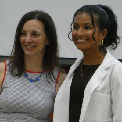 Rachel Ditoro and student at white coat thumb1