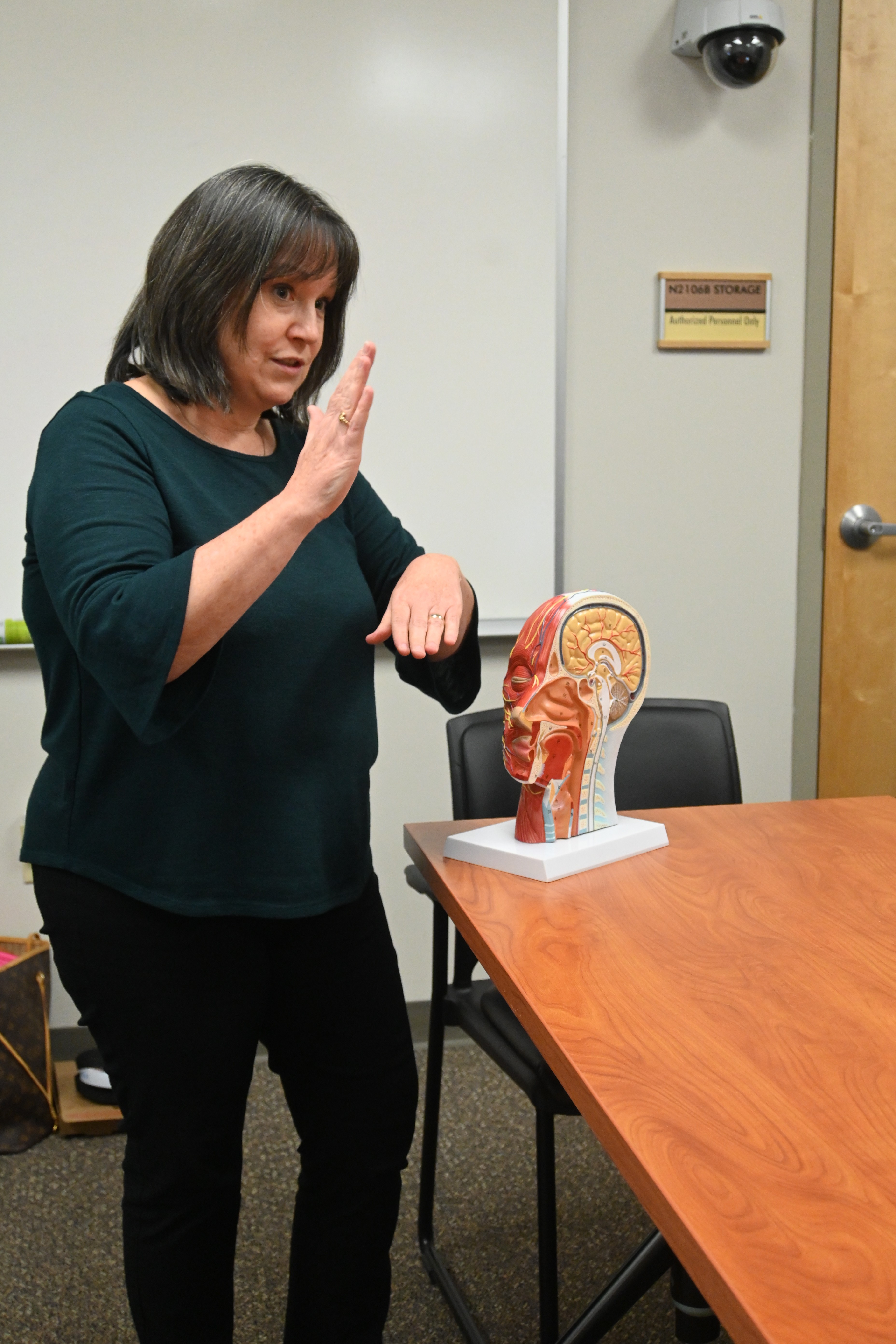 Patricia Mayro with SLI students in class