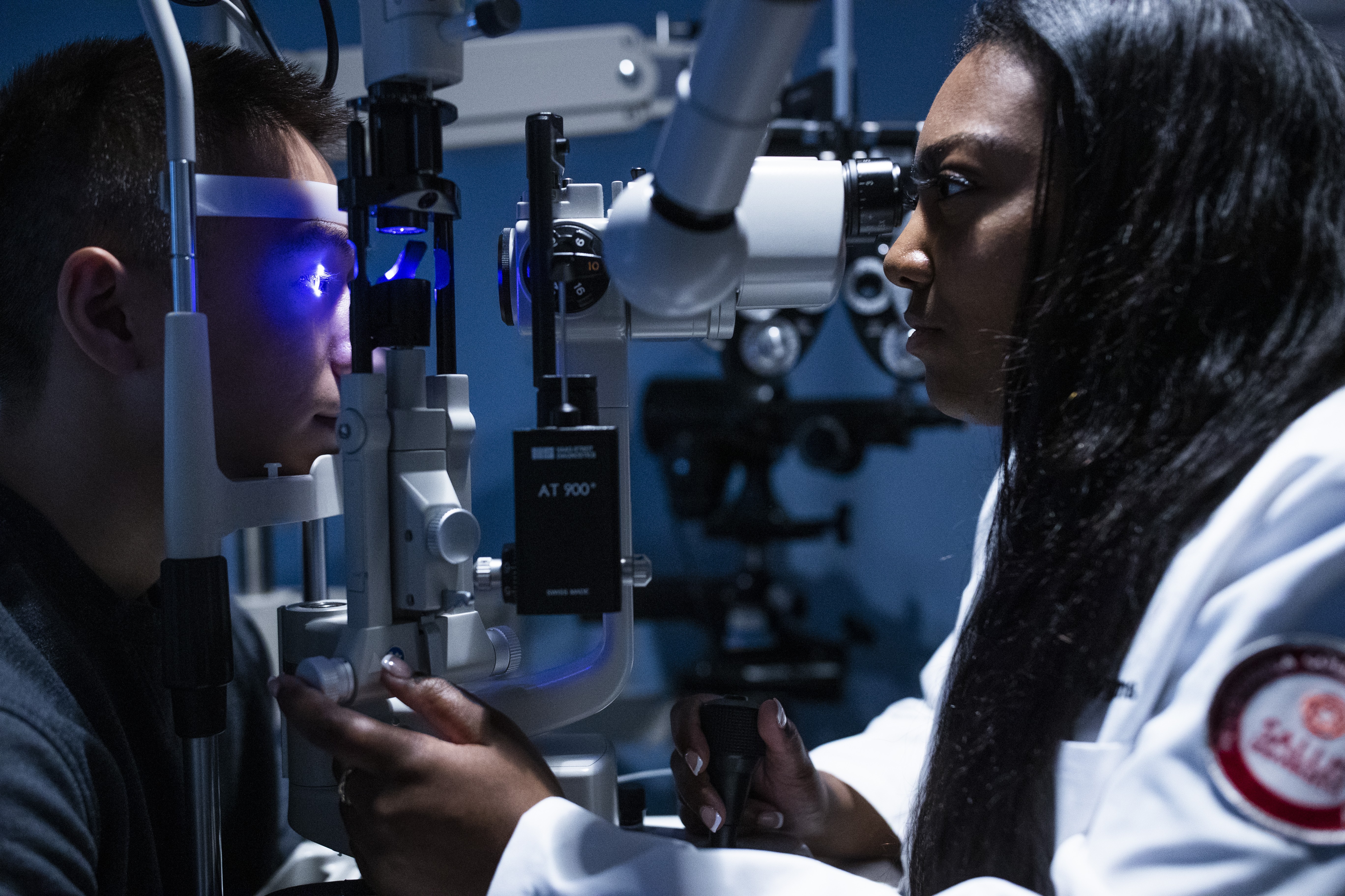 Student doing an eye exam in the lab pic