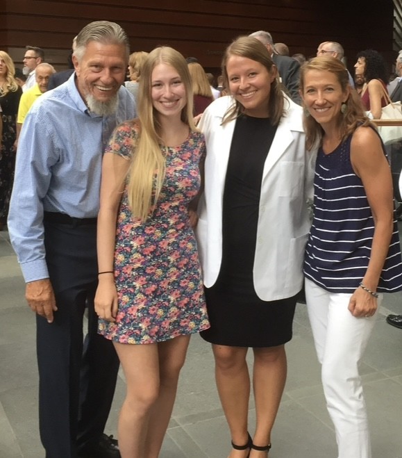 Sara Ostrowski and family at white coat