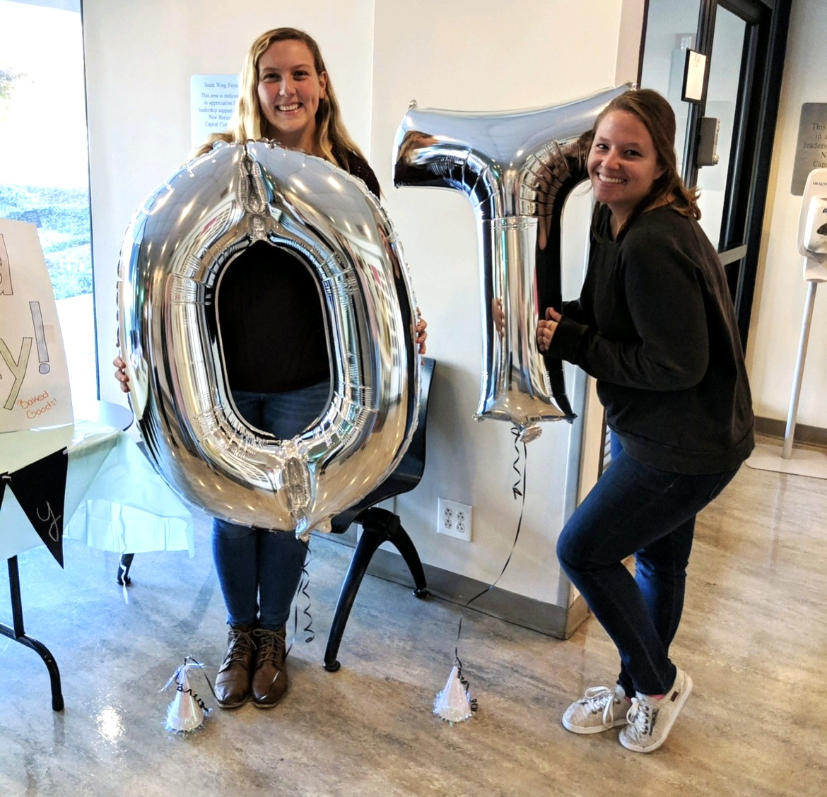Sara Ostrwoski and classmate holding O and T balloons