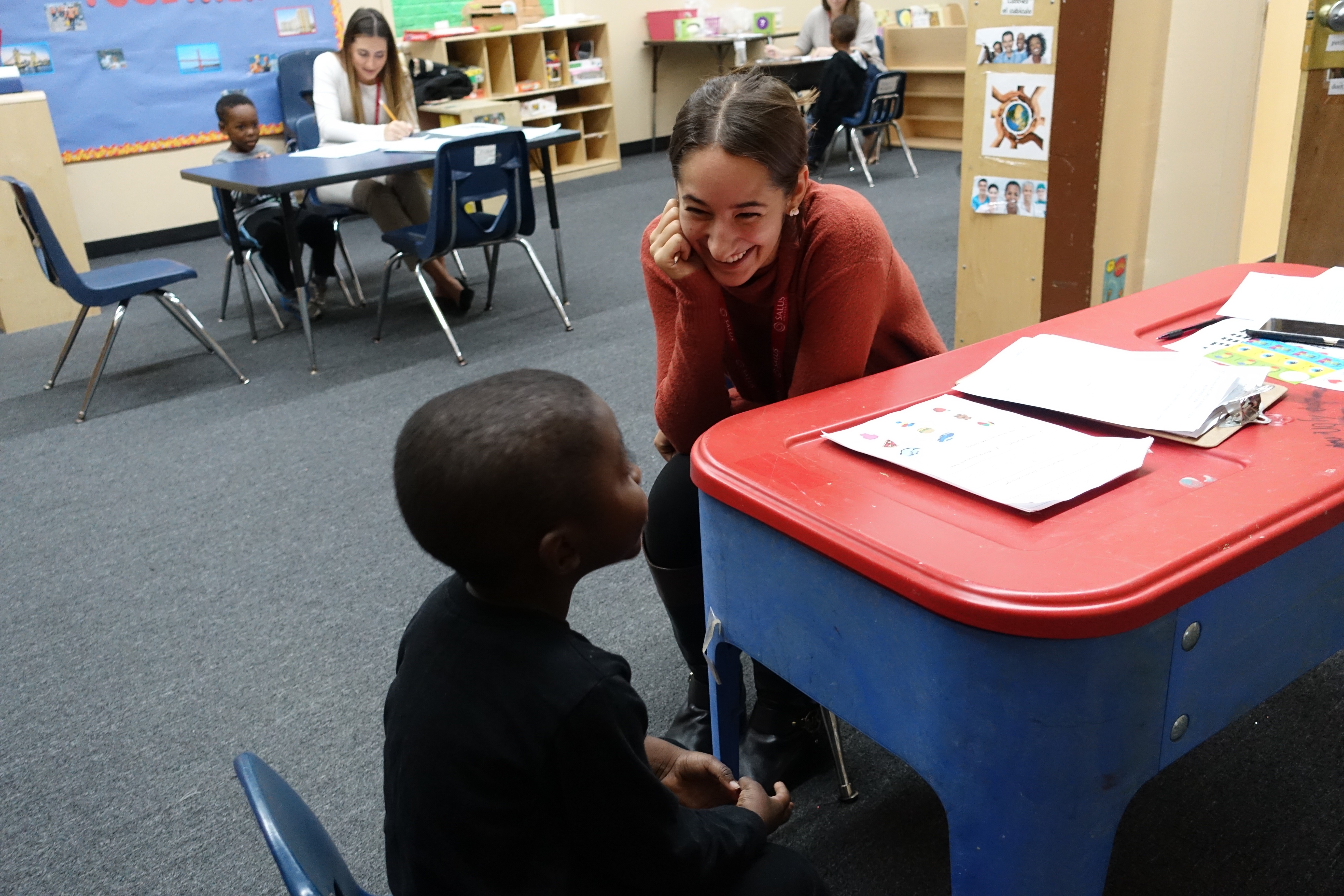 SLI student with elementary student at screening pic