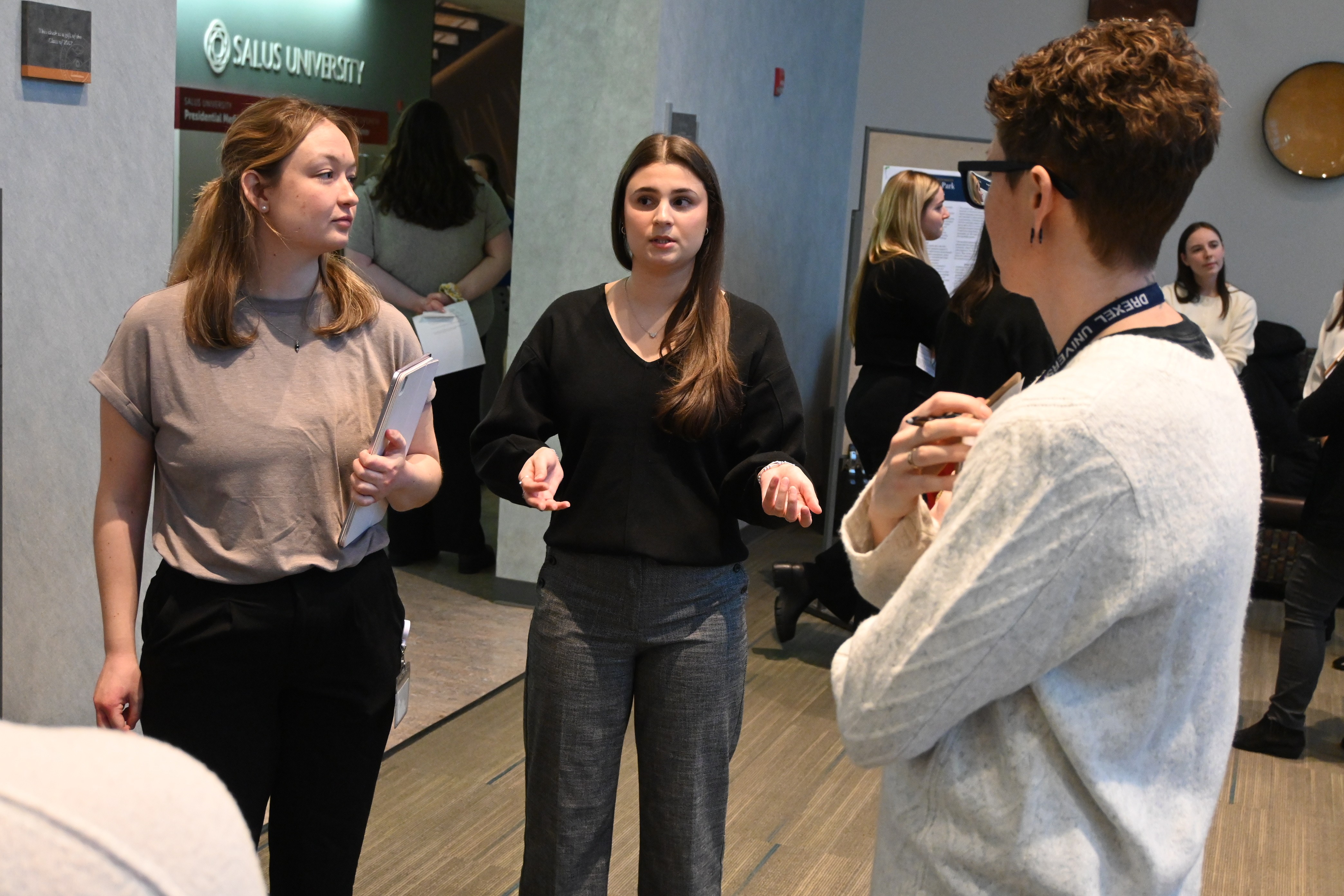 SLP Capstone students explain their poster pic3