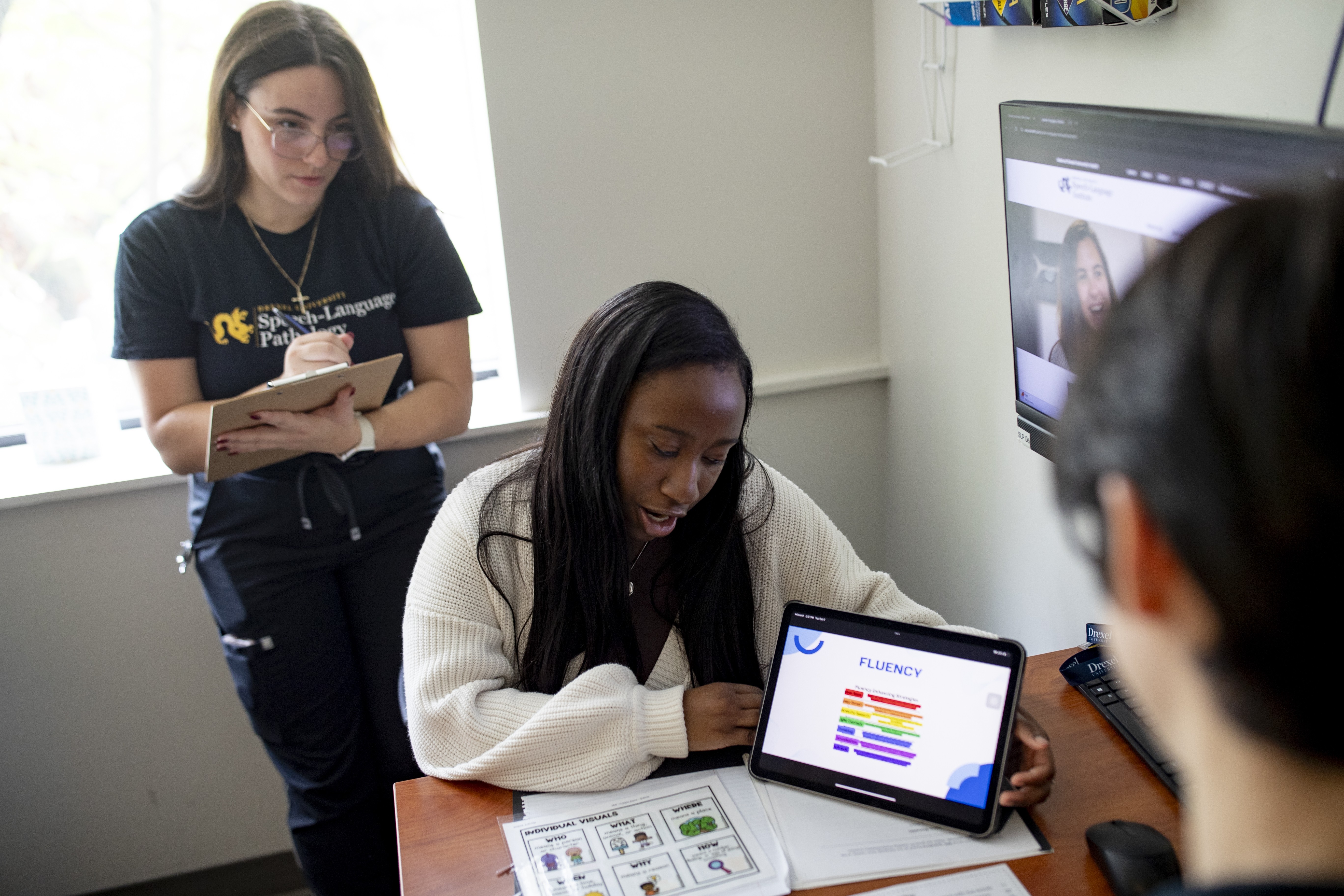 Students with client in SLP lab pic1