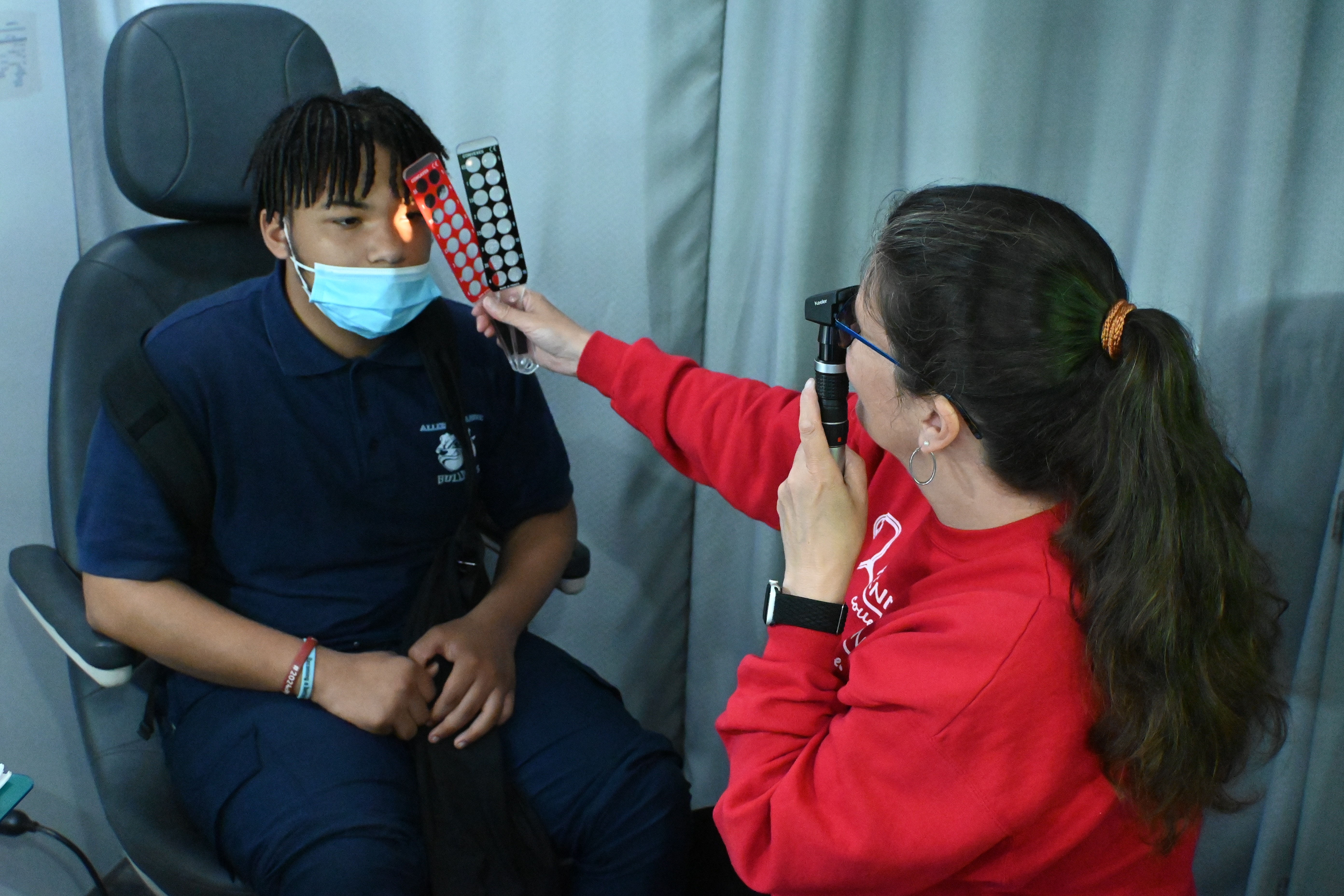 Dr. Scombordi examines Stearne student