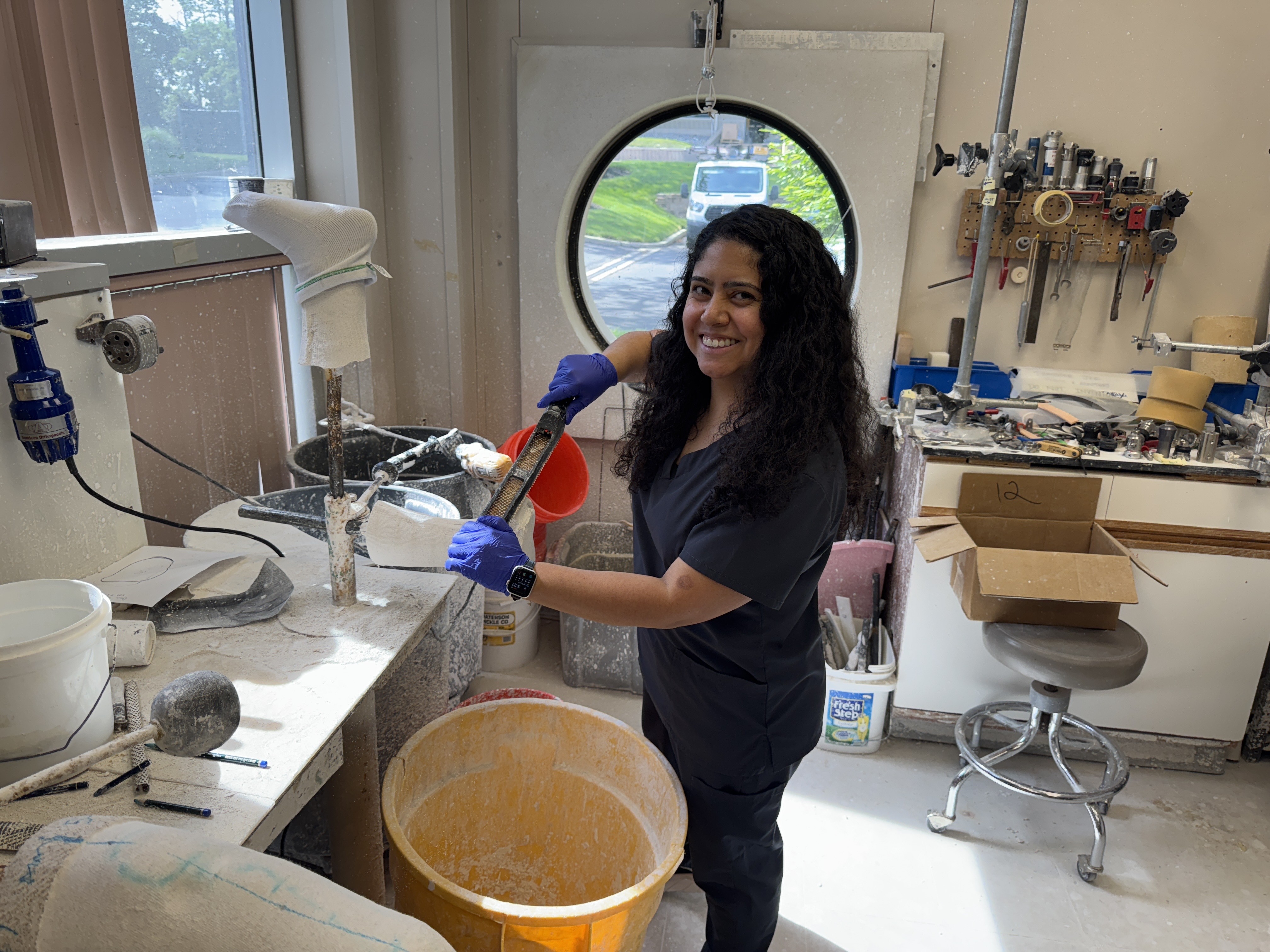 O&P student Stephanie Maltez mixing plaster in the lab