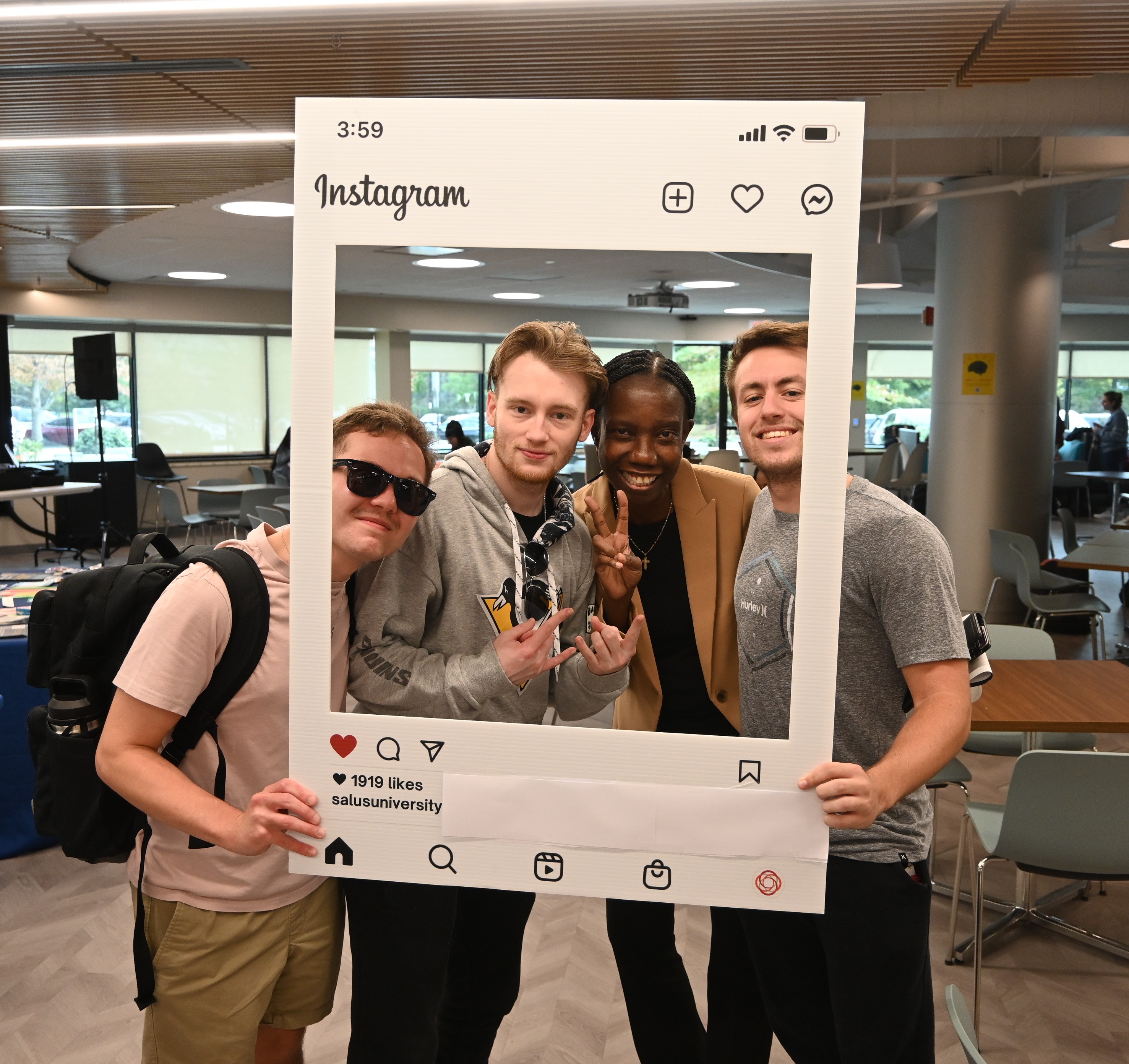 Dr. Ibironke with students at resource fair