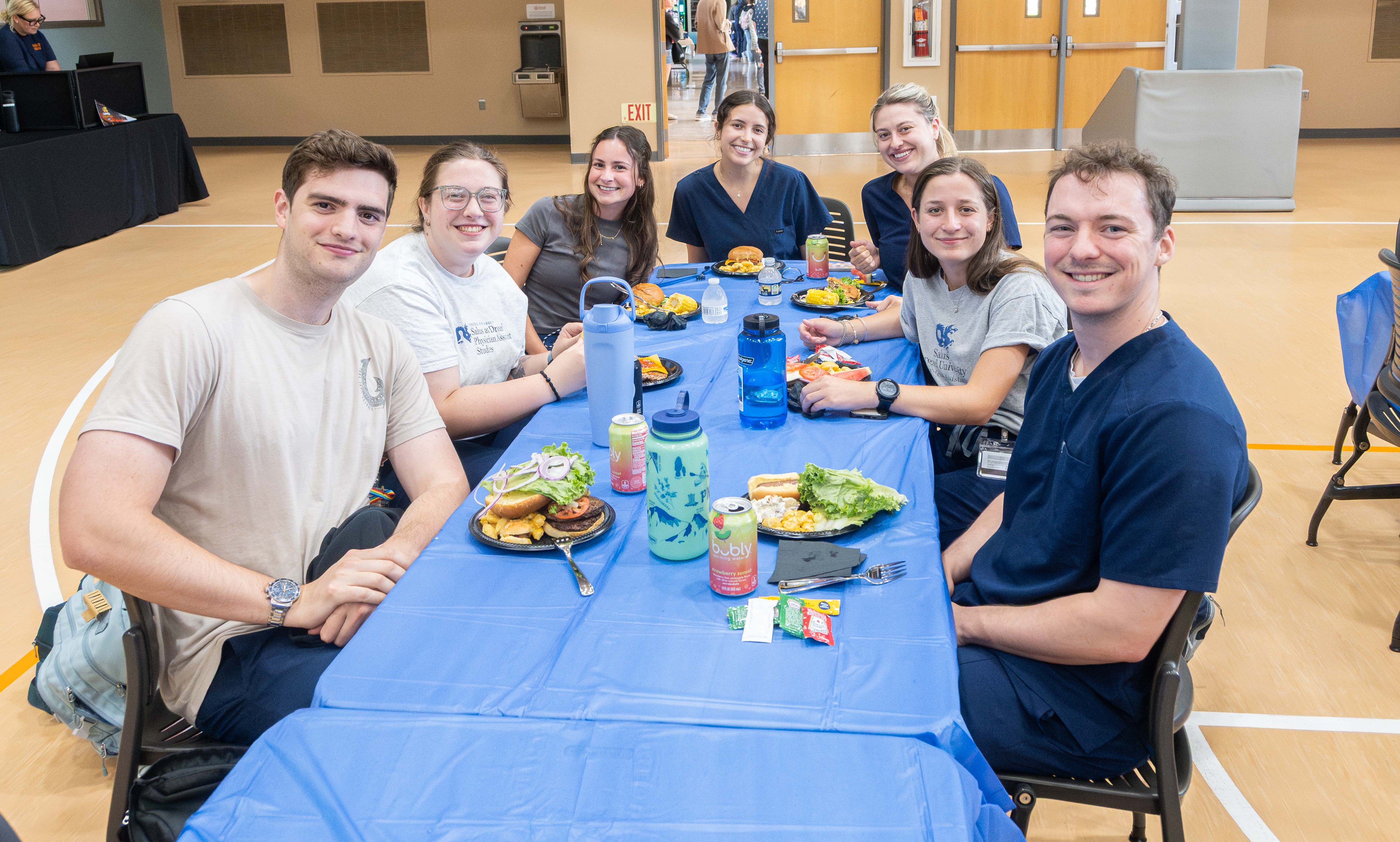 PA students at table enjoying summer bash
