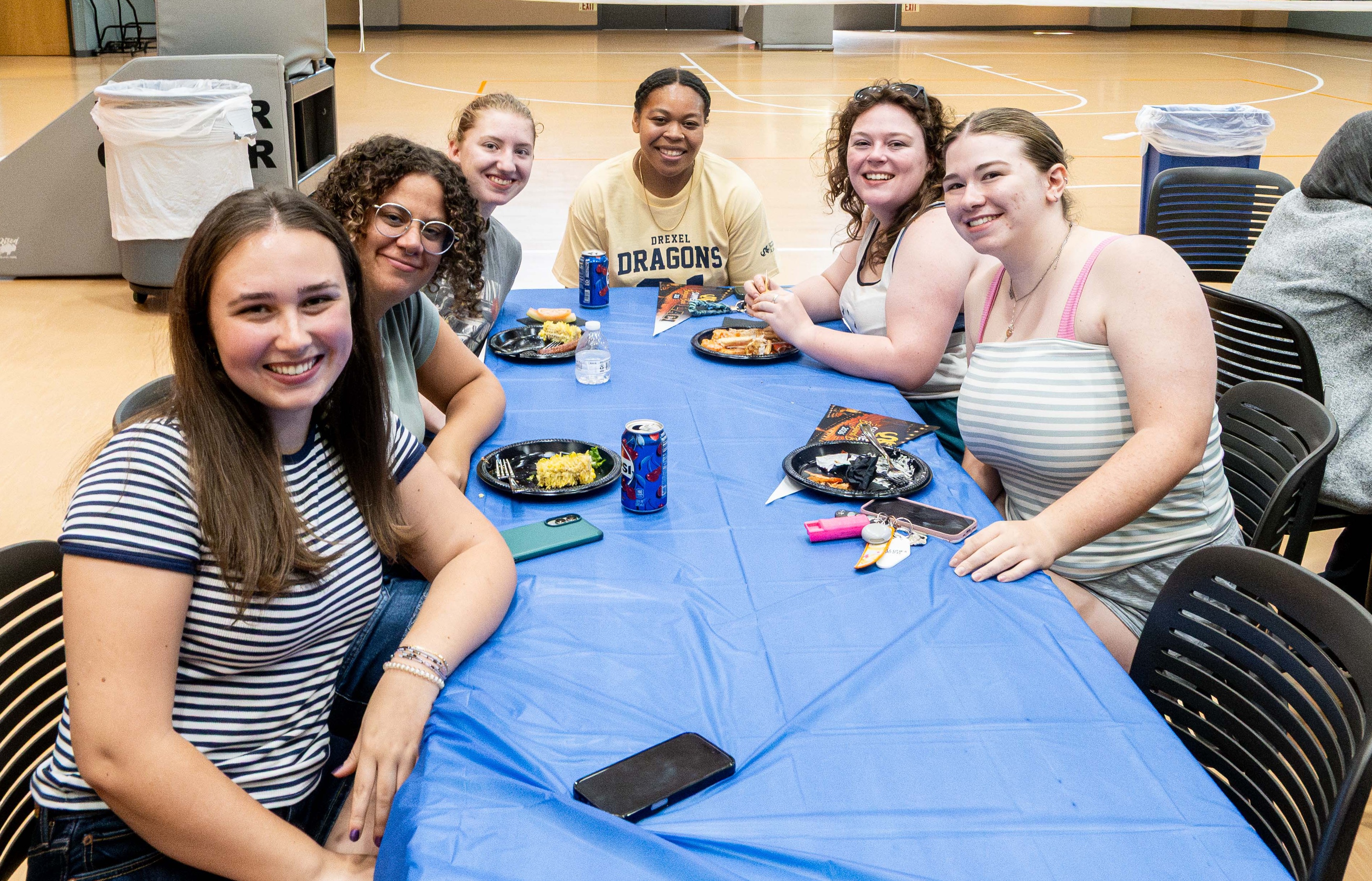 Student around the table at summer barbecue