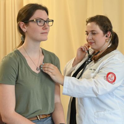 PA examines a patient thumb1 pic