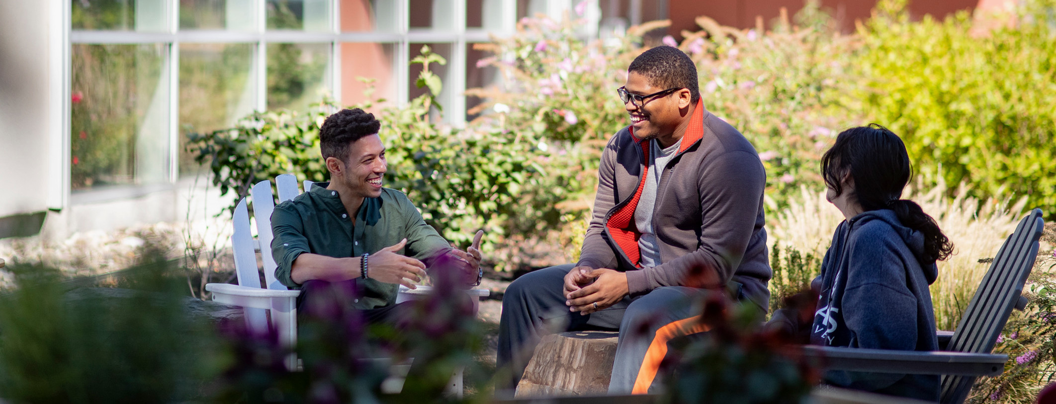 students talking in sensory garden