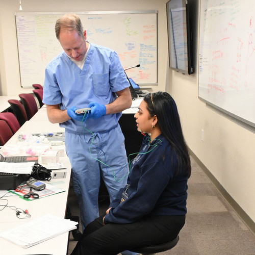 SLP student in dysphagia lab