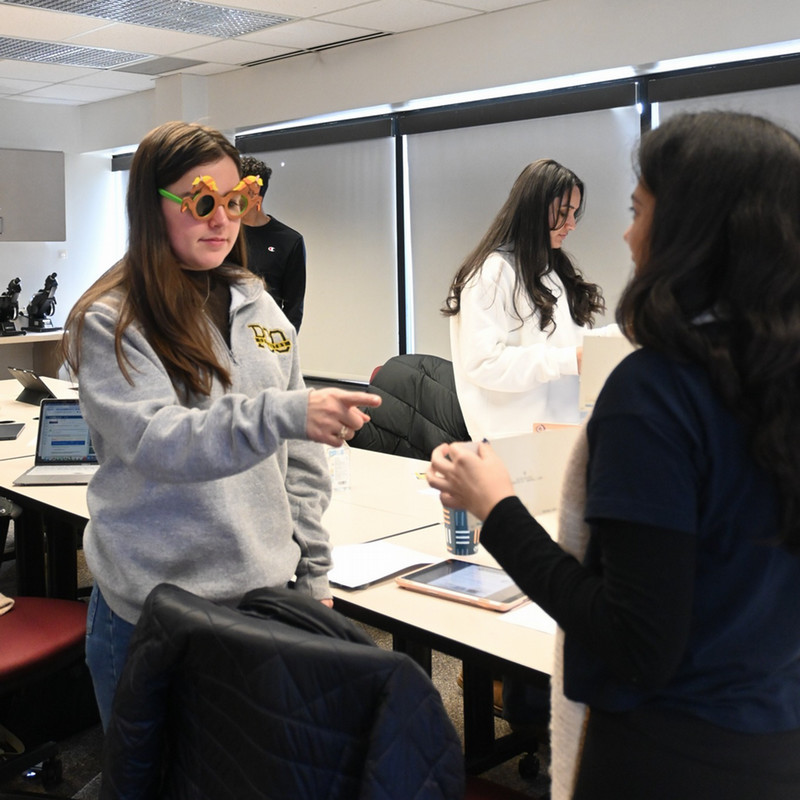 optometry student wearing pediatric glasses and experiencing eye exam