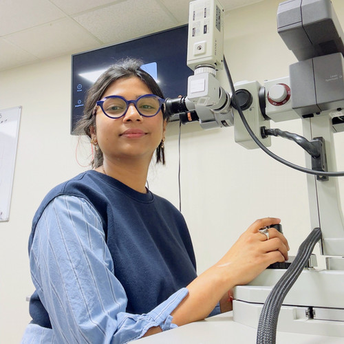 optometry student using a laser in lab