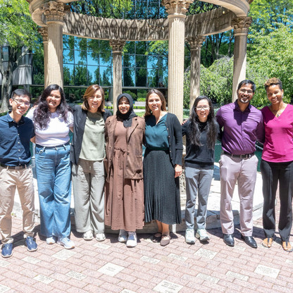 group photo of audiology students in front of the gazebo