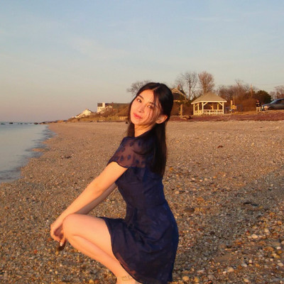 Naomi posing on the beach