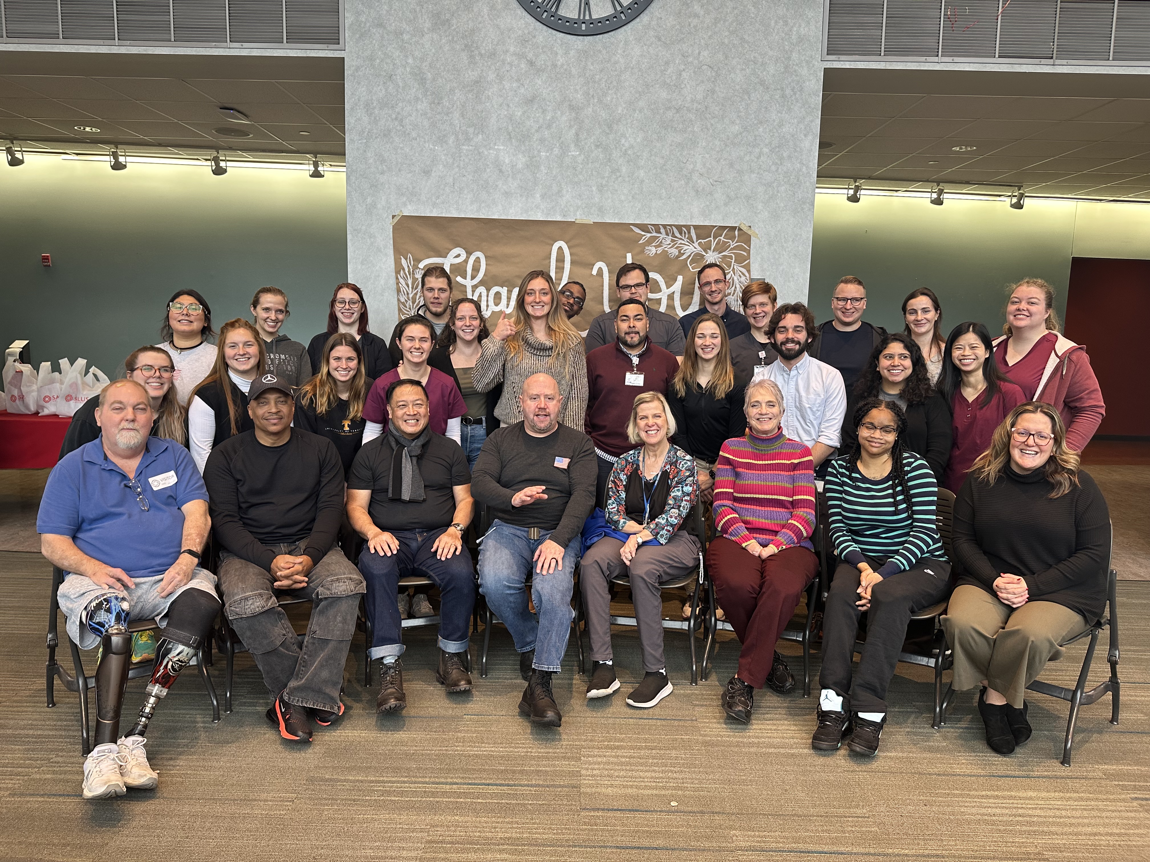 group photo of patient models and students