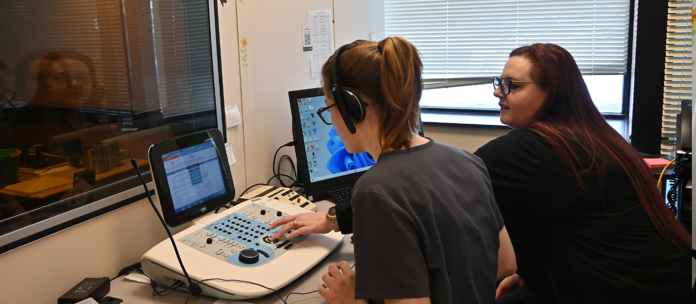 audiology student and faculty in clinic