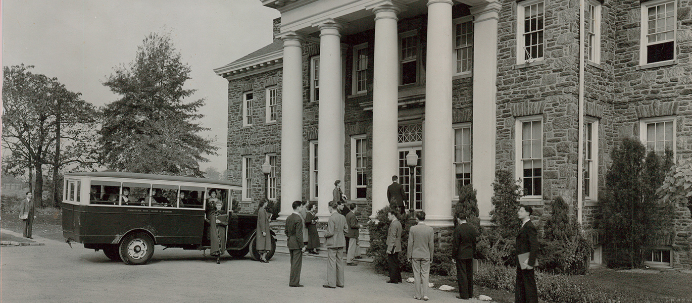 black and white photo of optometrists outside building