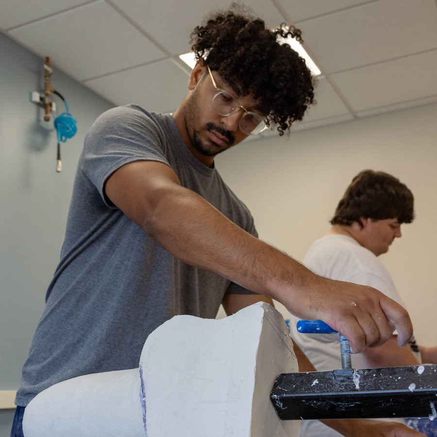 O&P student shaping prosthetic mold