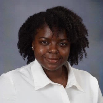 headshot of student wearing a white shirt
