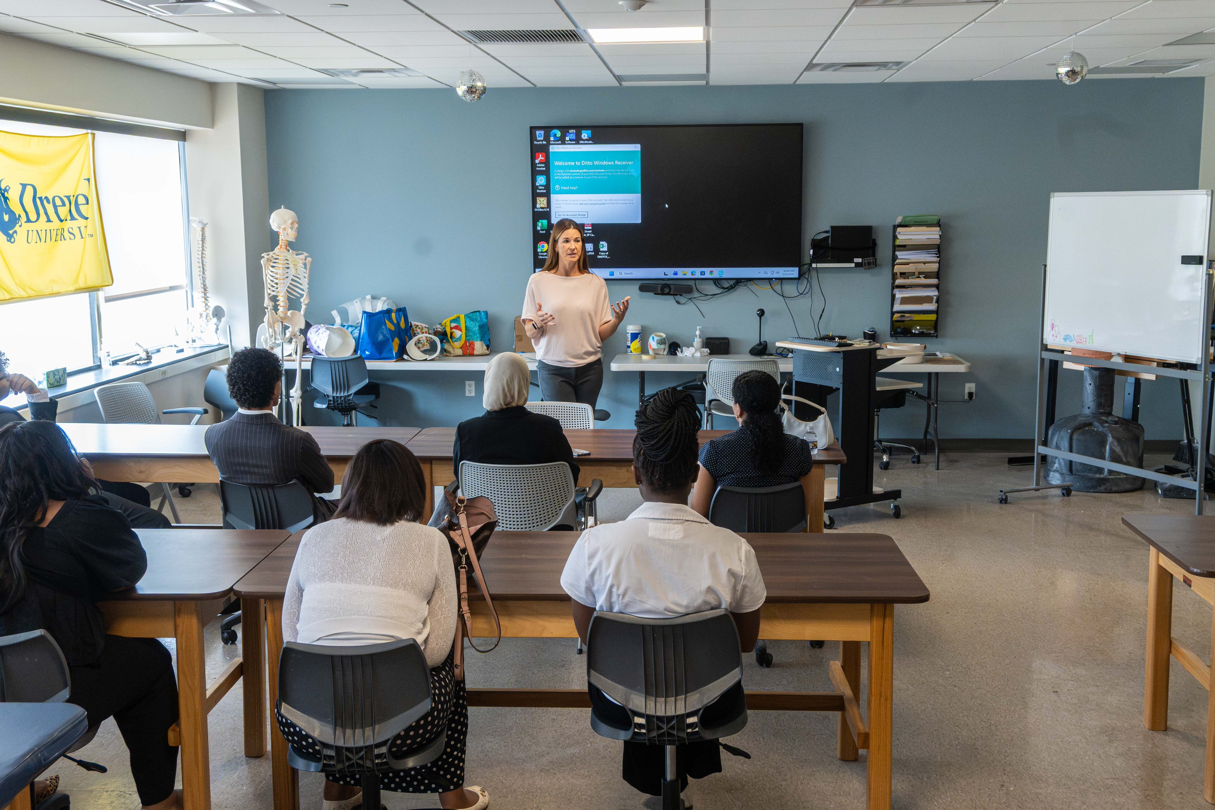 O&P faculty member speaking to students in classroom