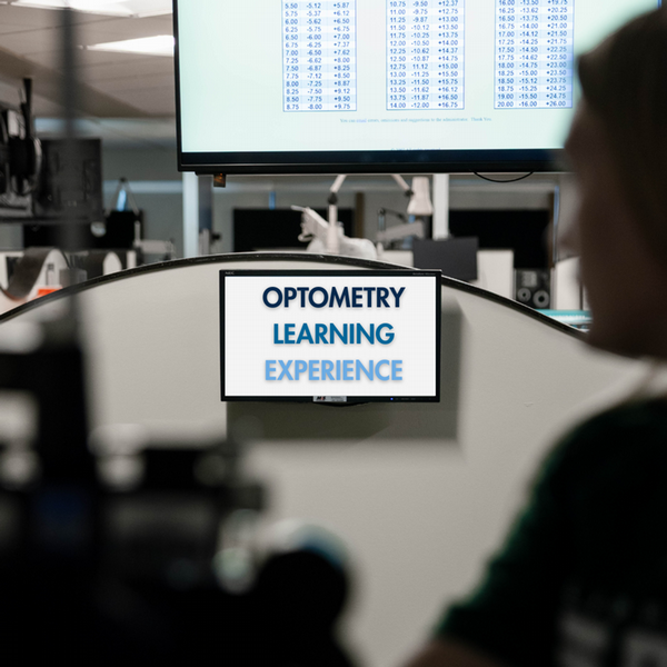 optometry learning experience written on screen in lab