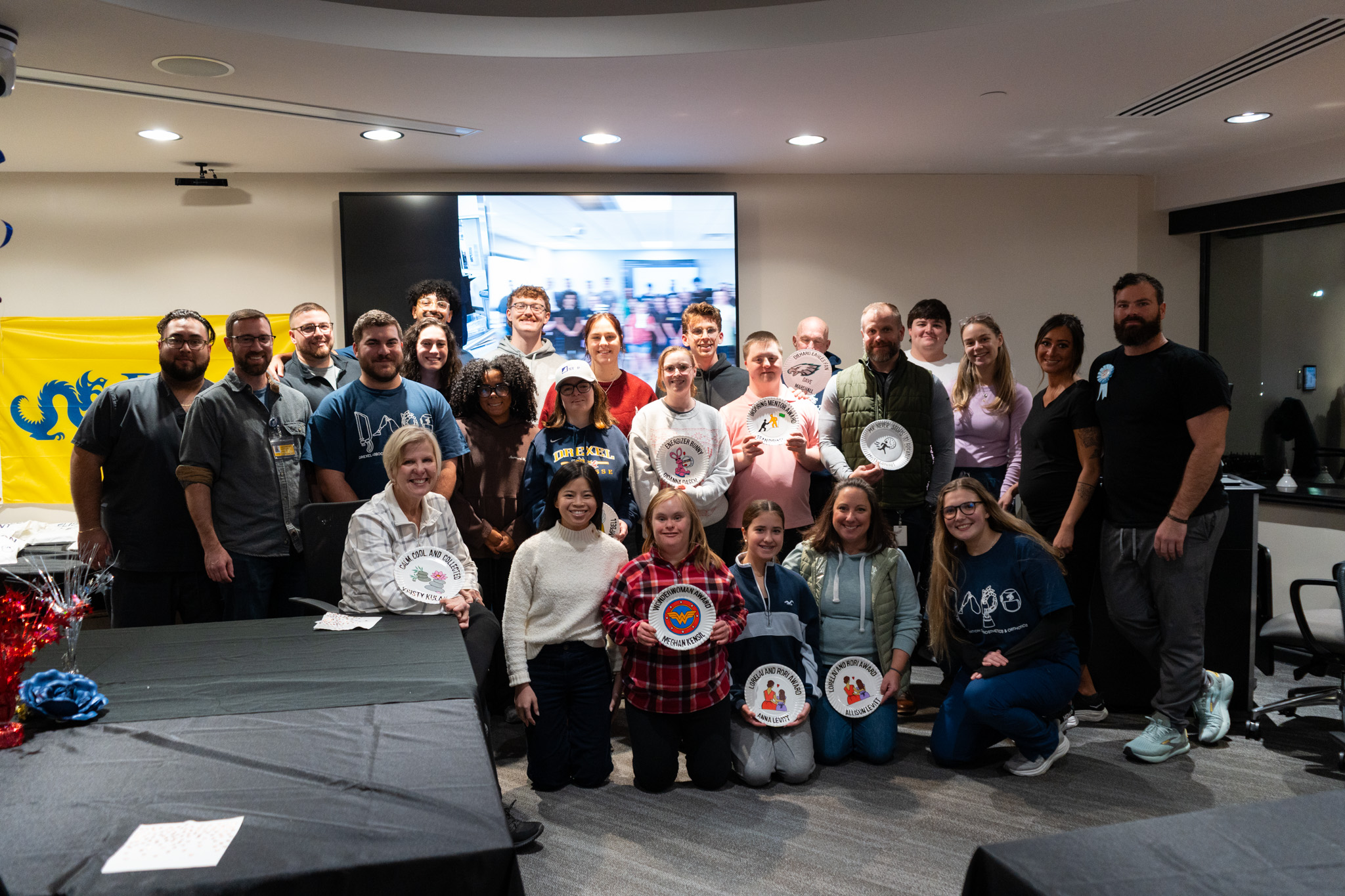 group photo of patient models and students