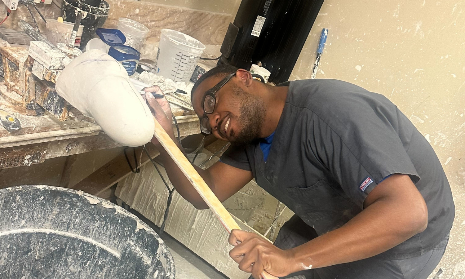 student creating prosthetic