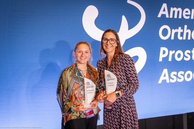 Mary-Kate and o&p student holding awards